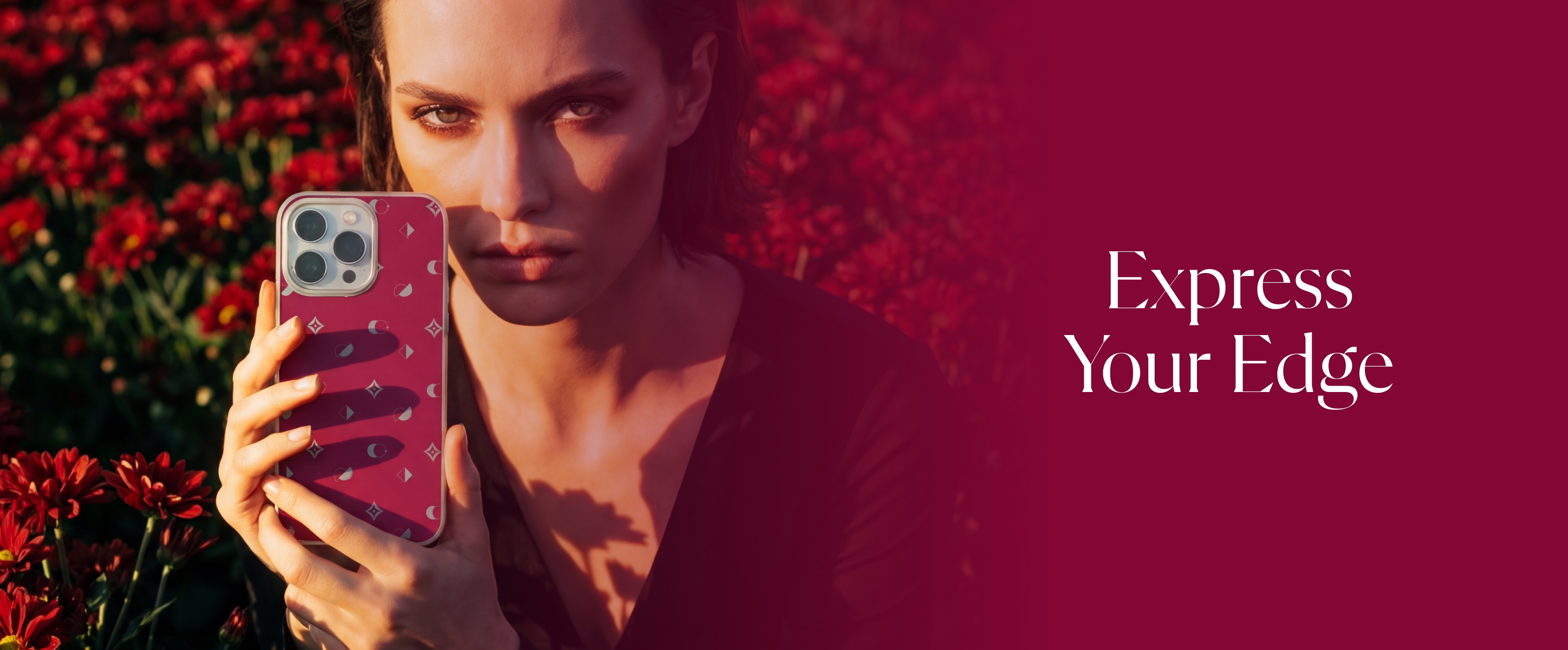 Model holding a cerise Whimzy monogram phone case beside the words Express Your Edge