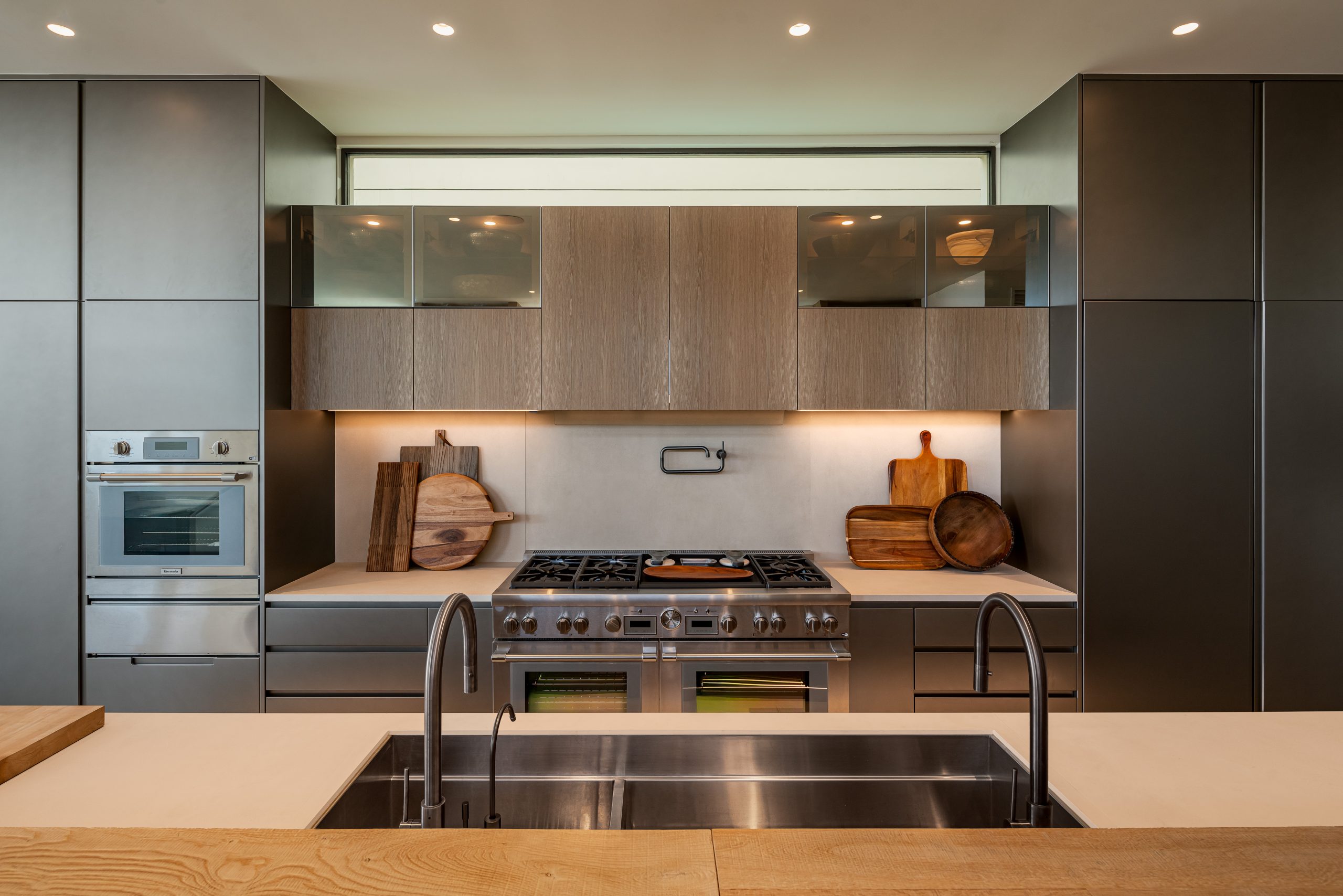 Modern luxury kitchen with professional-grade appliances and custom wood cabinetry