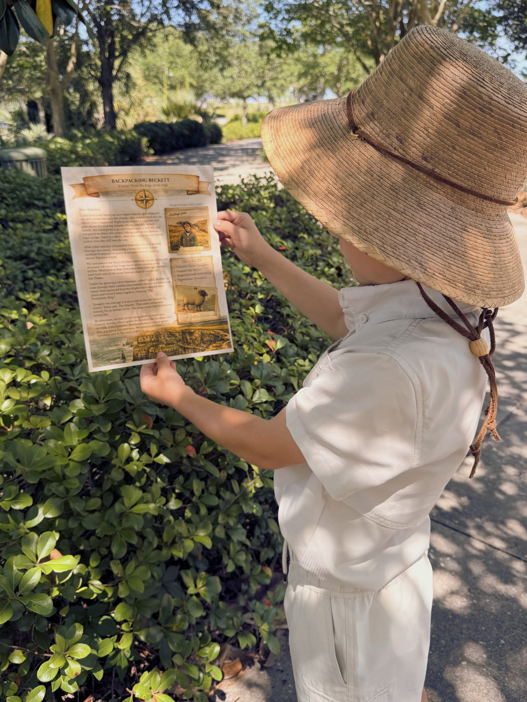 Child reading Backpacking Beckett letter outdoors