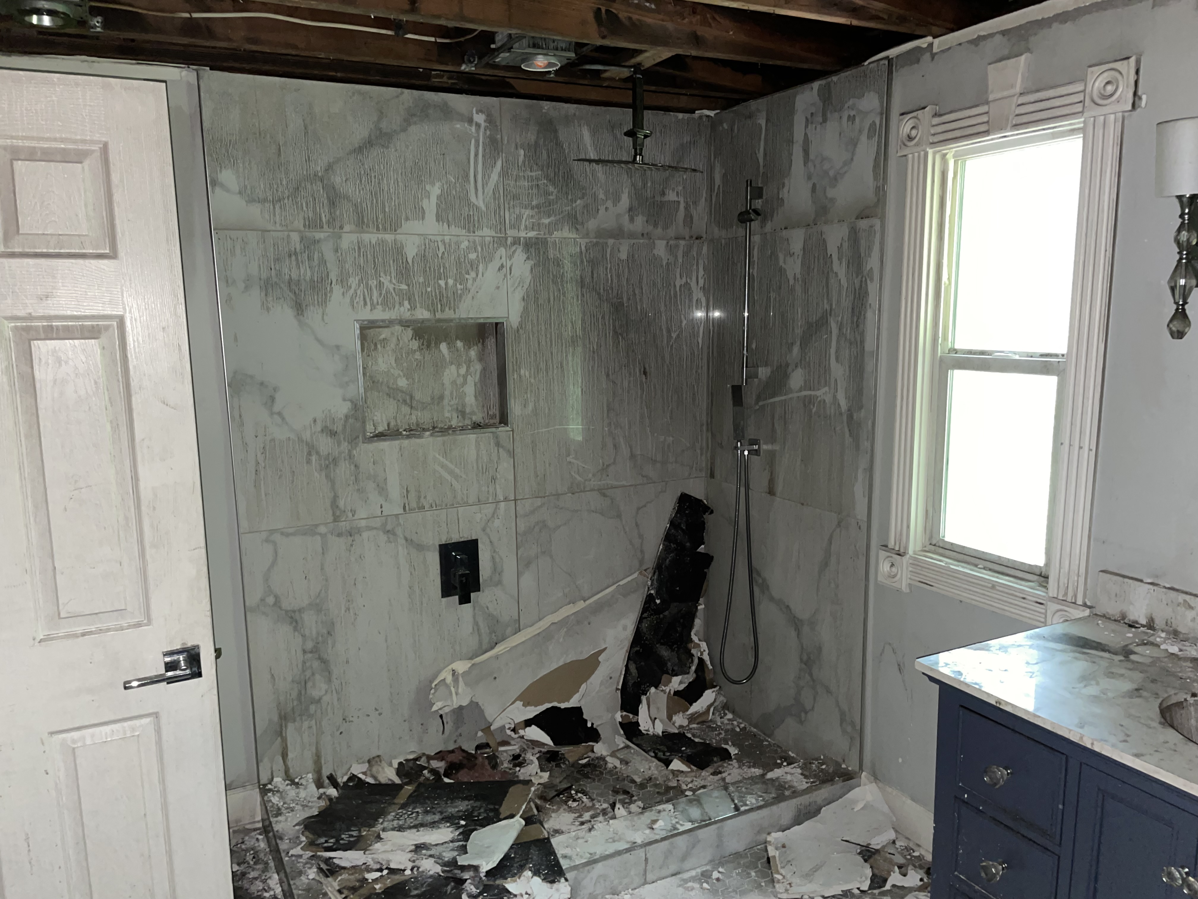 Fire-damaged bathroom before restoration