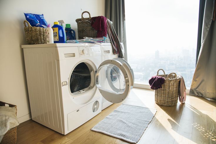 Modern washer and dryer set with open dryer door