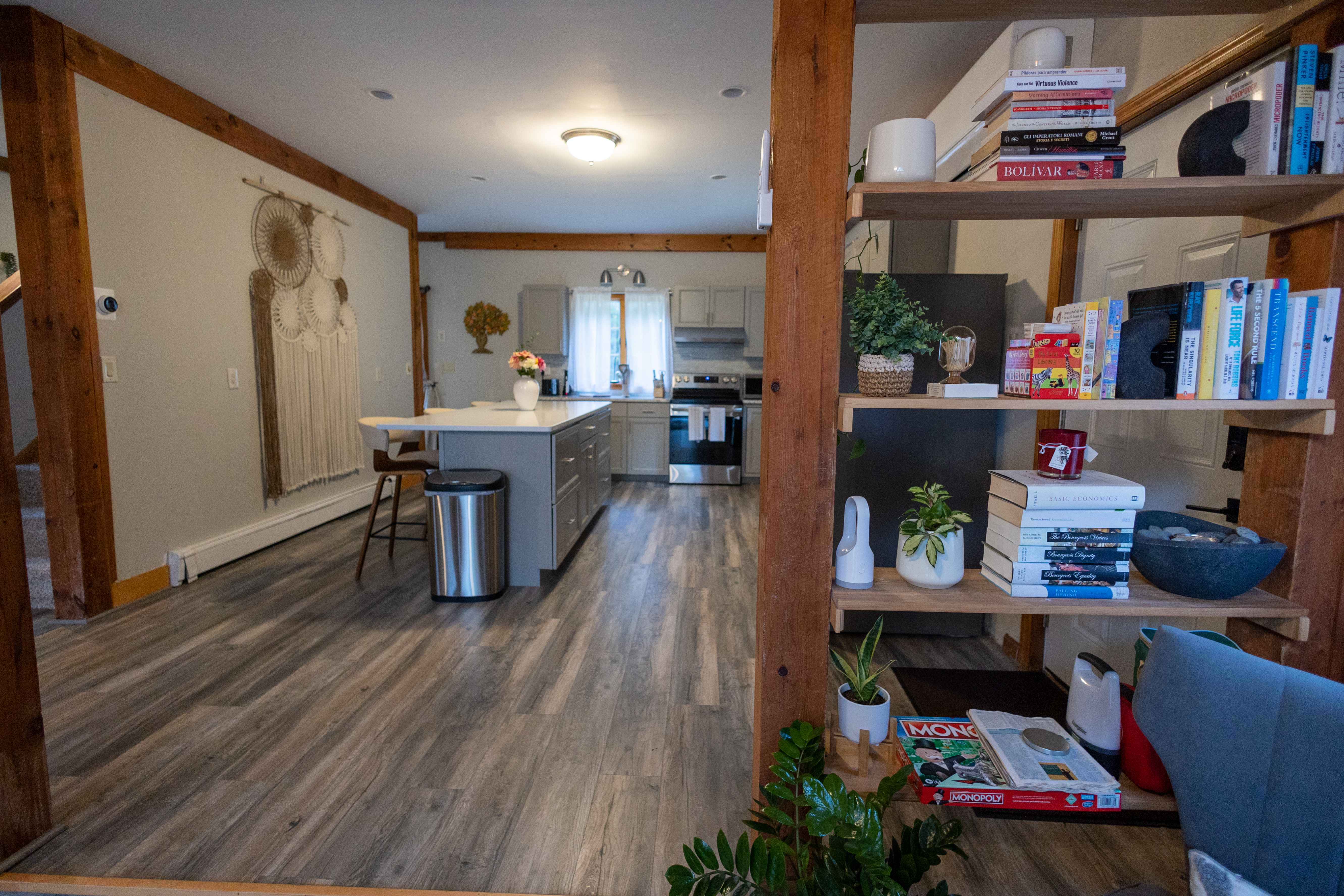 Open kitchen and living area with wooden beams