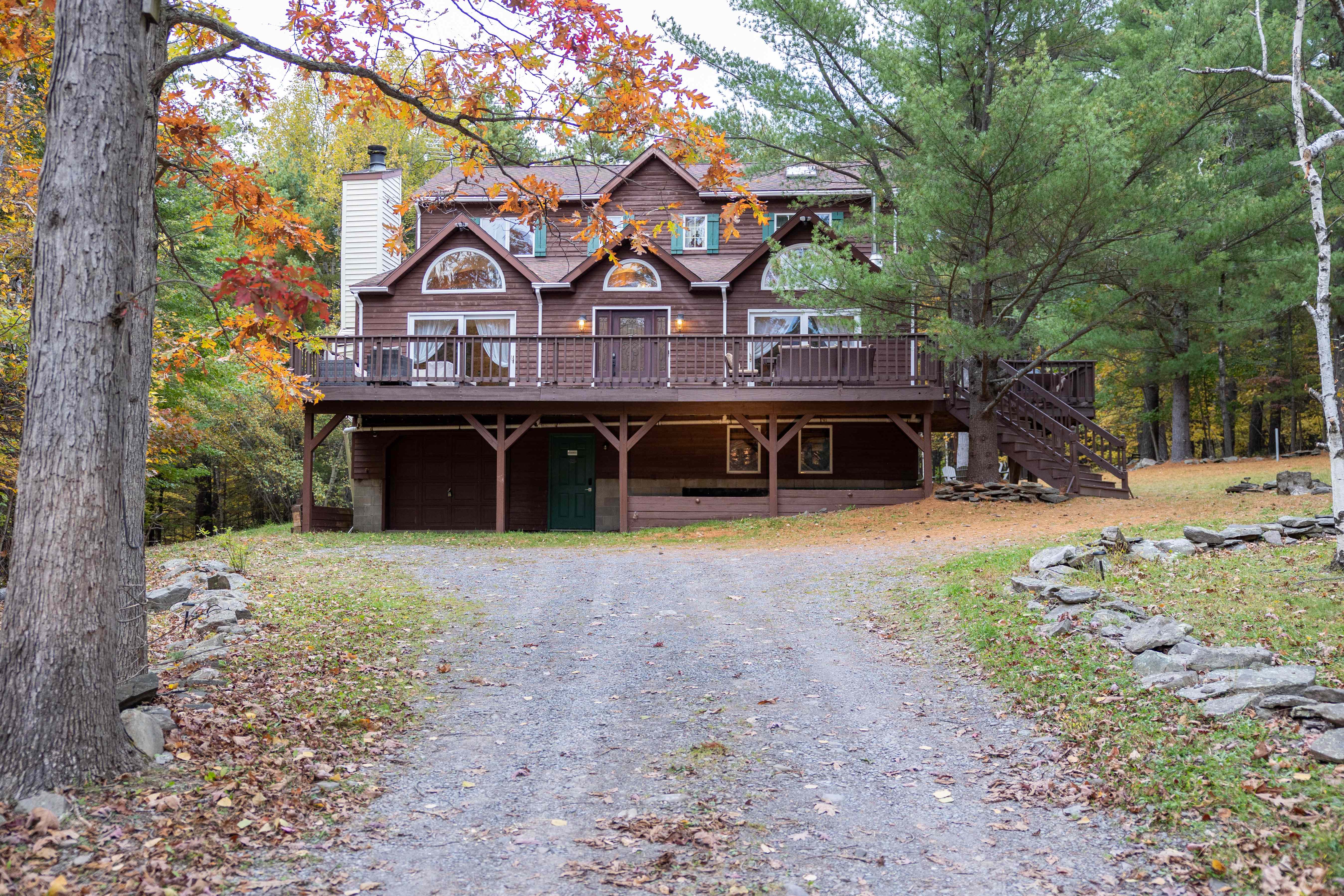 Cabin entrance with fall foliage