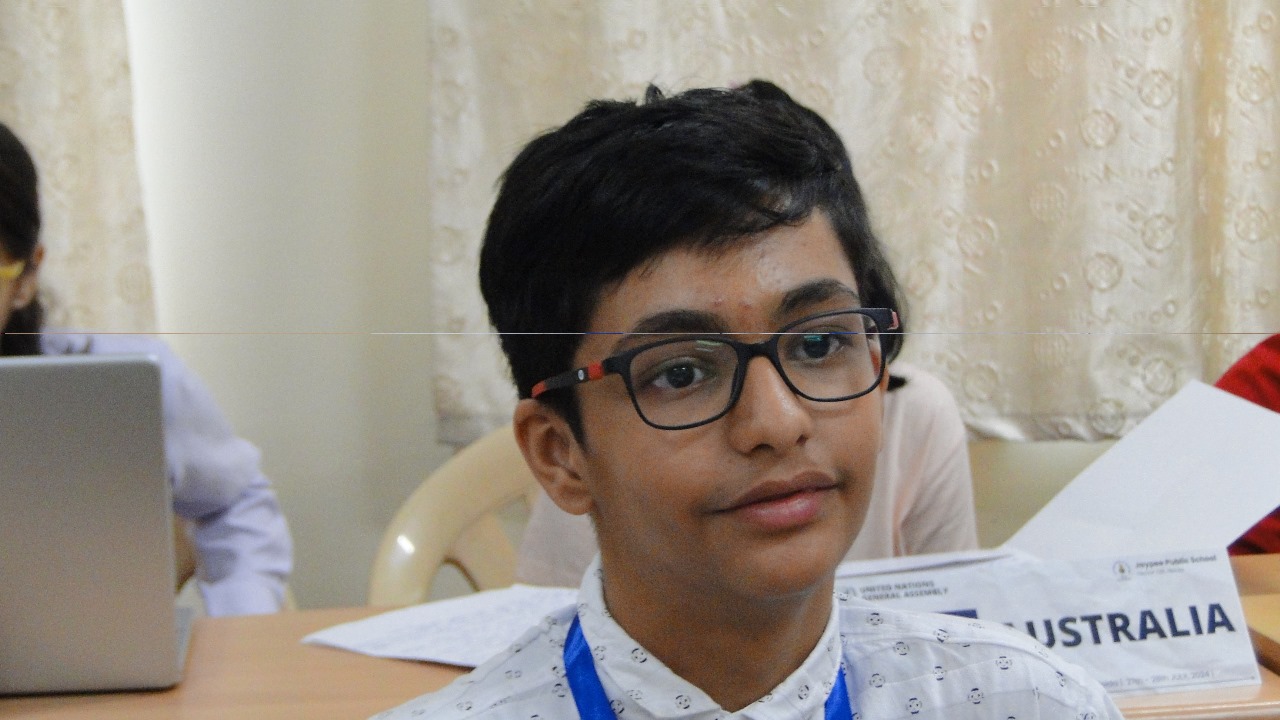 Akshat with students at an aerospace event