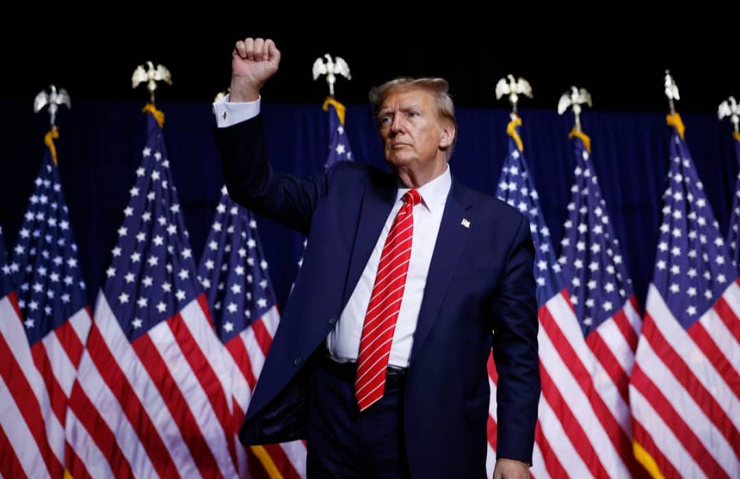 Presidential figure with American flags