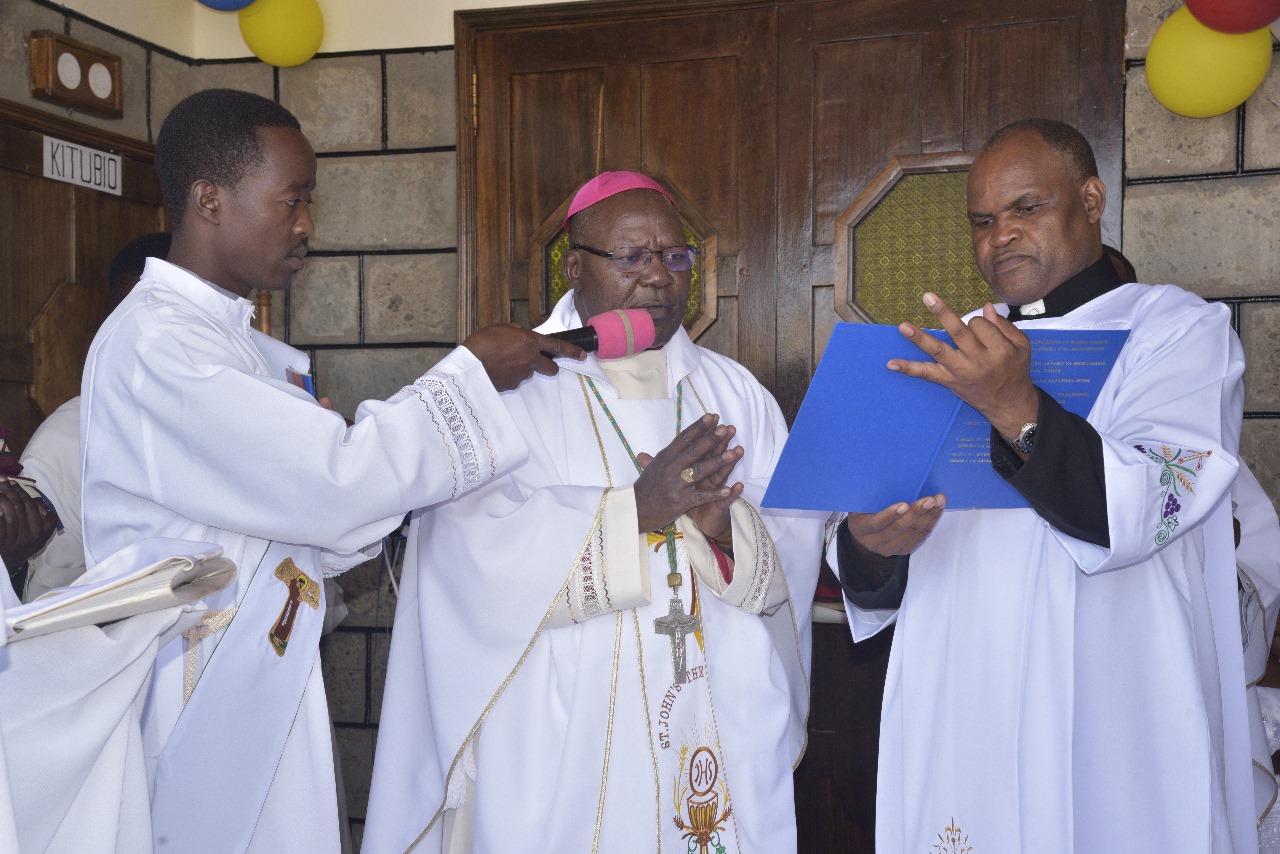 Bishop and clergy during an interview or recording session