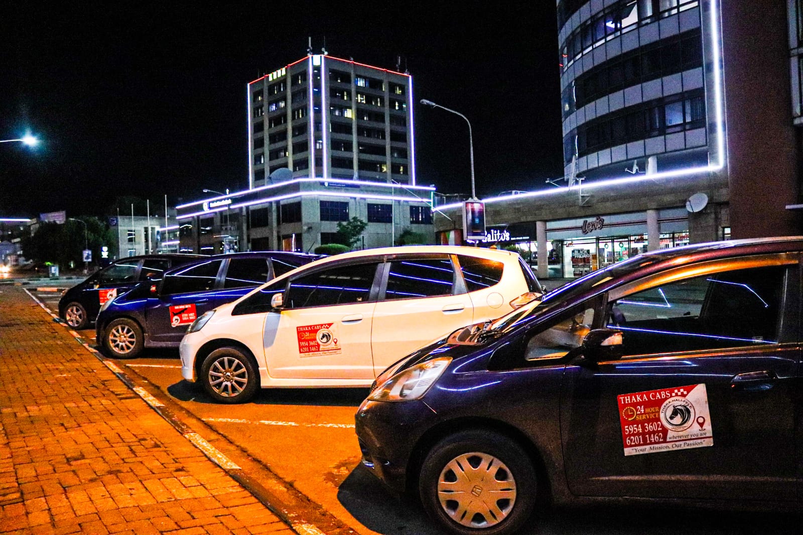 ThakaCabs fleet at night