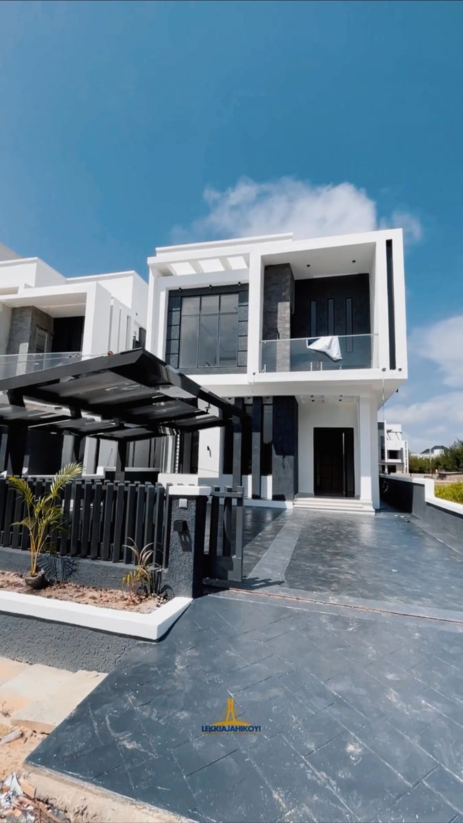 Modern black and white house with glass balconies