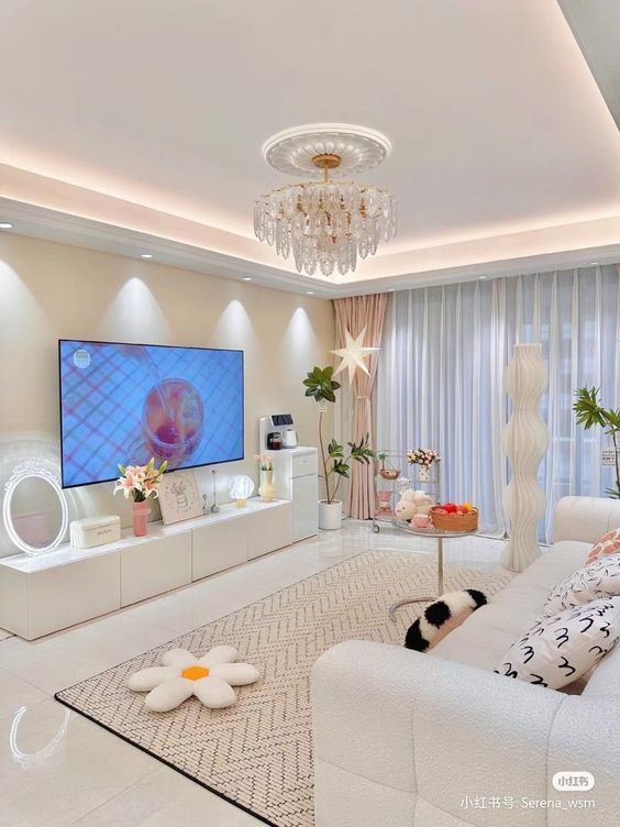 Clean minimalist white living room with crystal chandelier