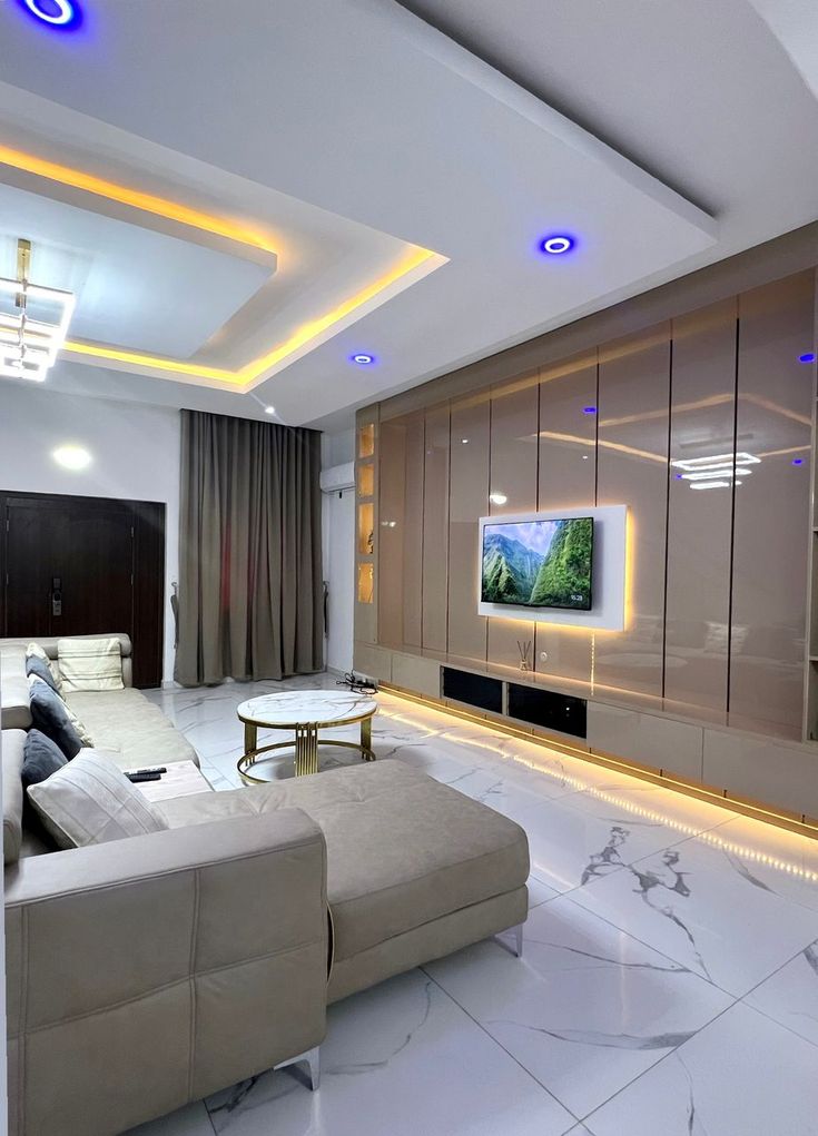 Modern living room with LED ceiling lights and marble floors