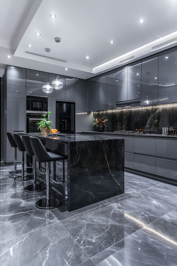 Modern gray kitchen with black marble island and countertops