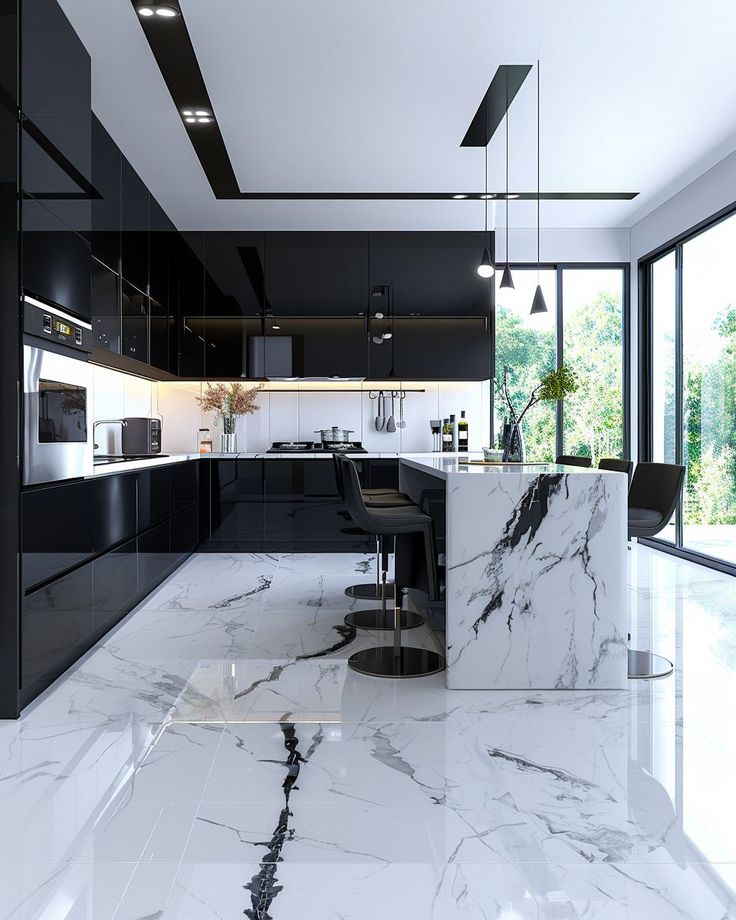 Modern kitchen with black cabinets and white marble floor/island