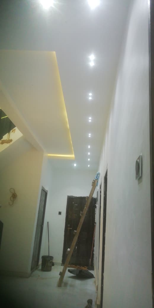 LED downlights and cove lighting installation in corridor