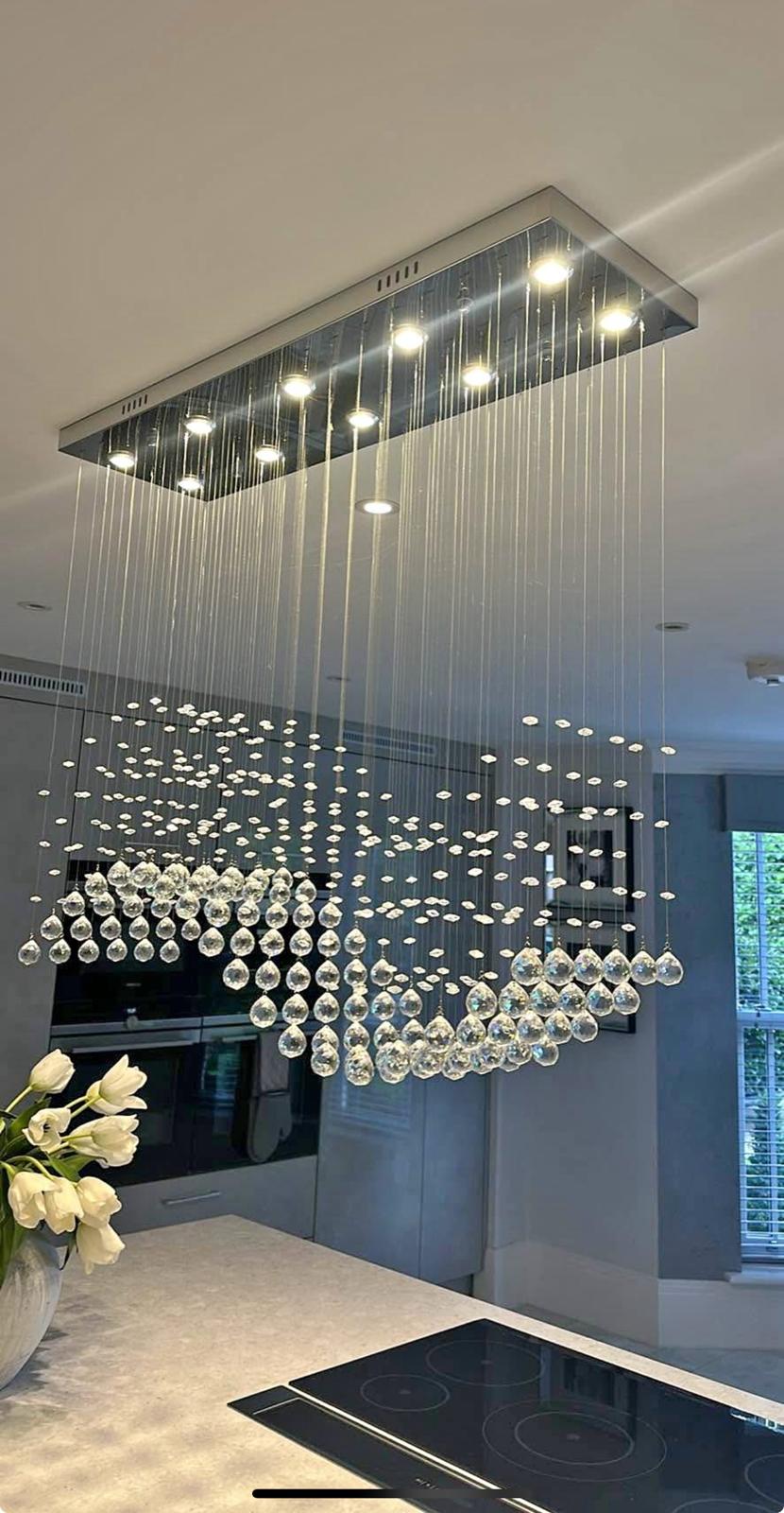 Large rectangular crystal chandelier in modern kitchen