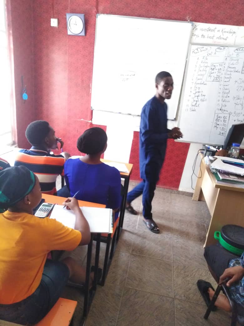 Teacher instructing at whiteboard