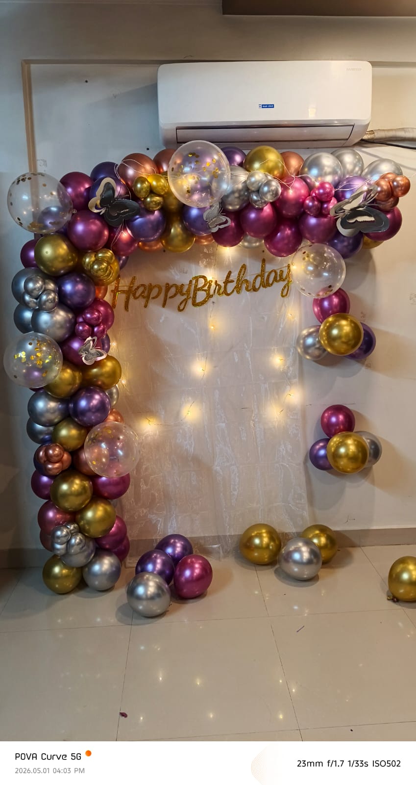 Metallic chrome balloon arch in gold, purple, pink, silver with fairy lights