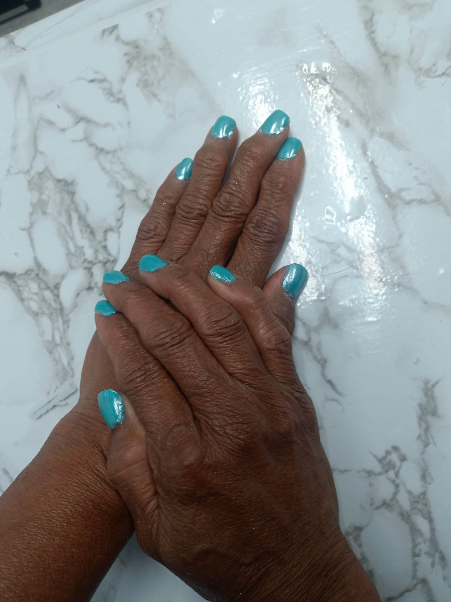 Turquoise nail polish manicure