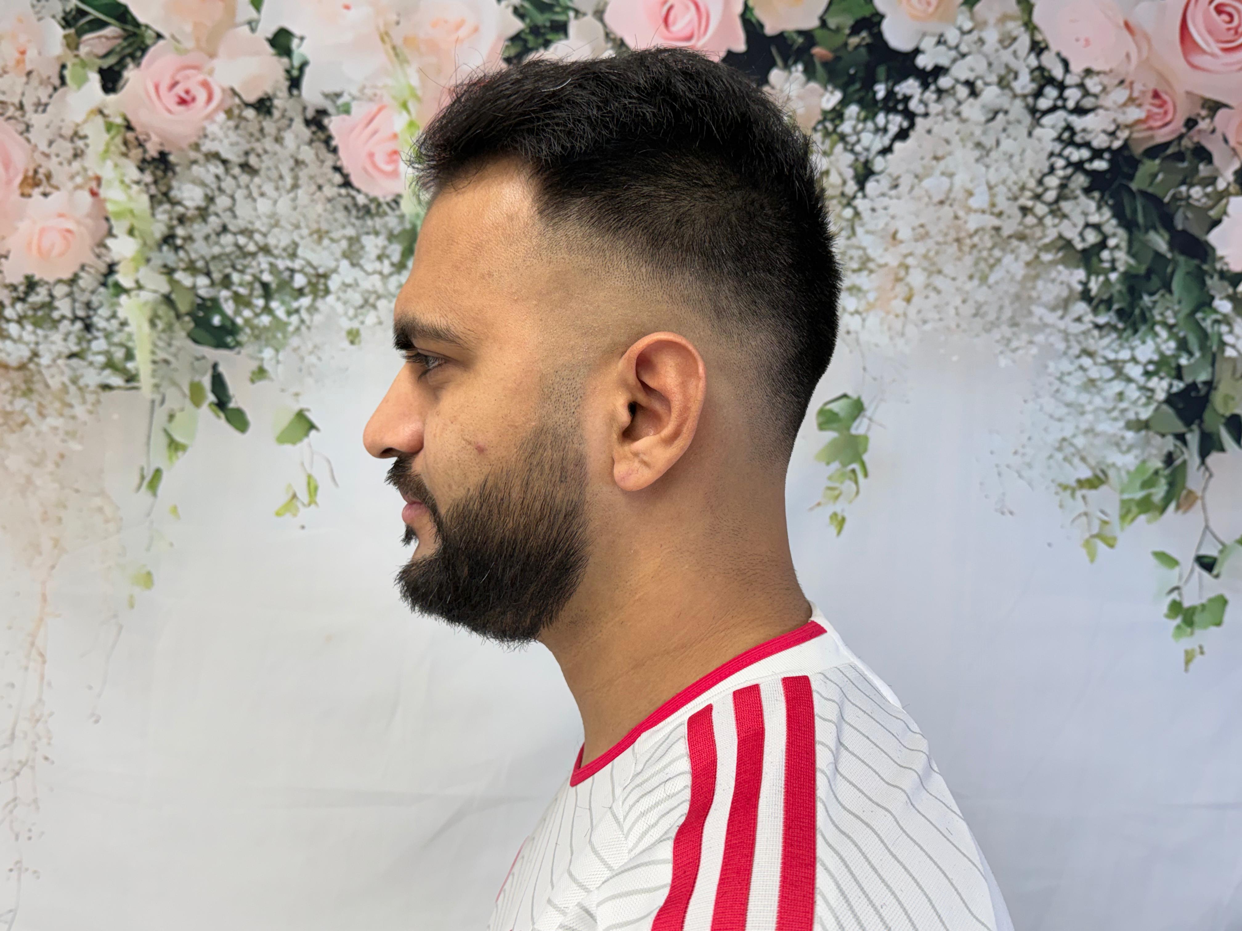 Men's fade haircut with beard trim