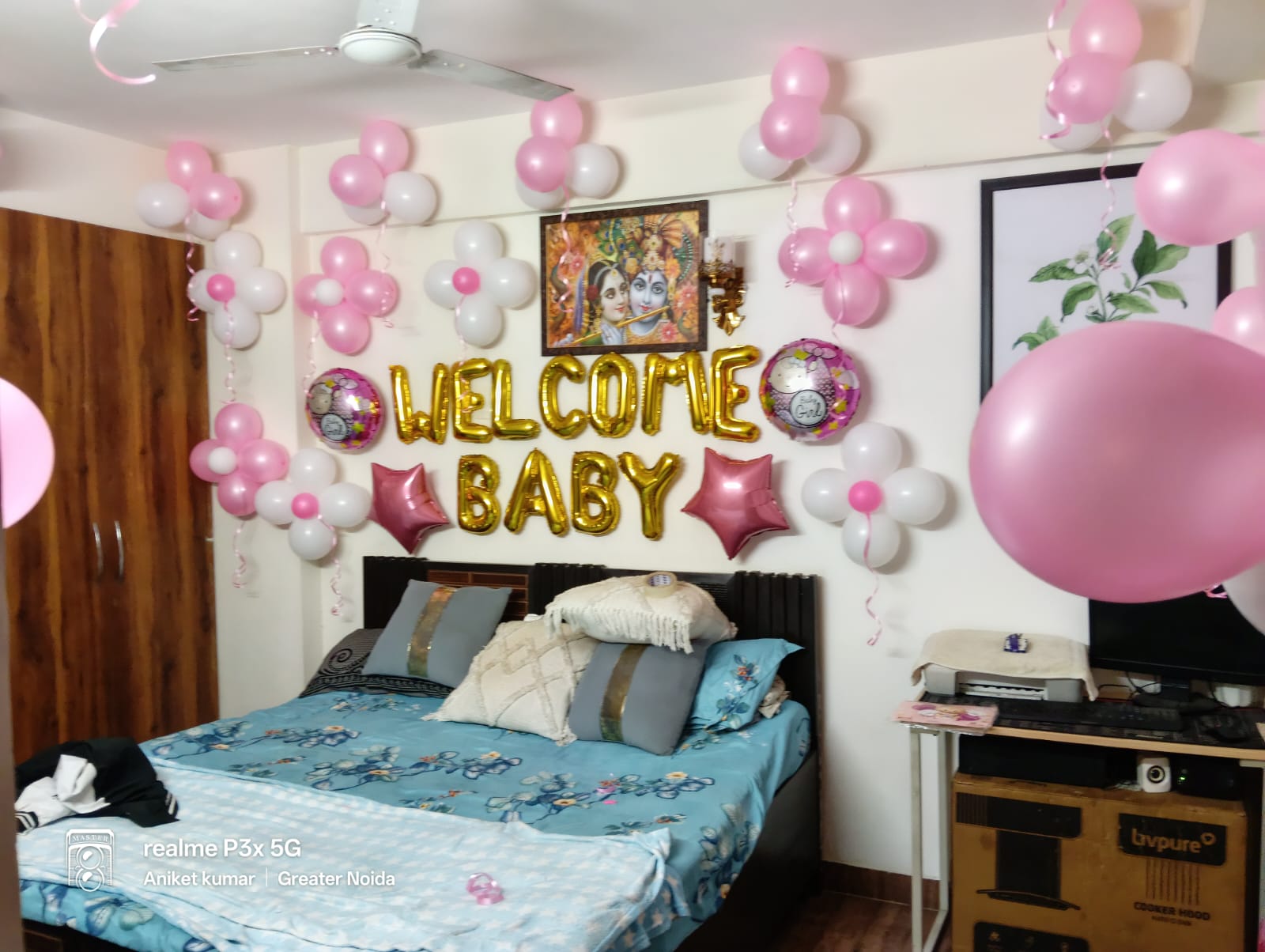 Welcome Baby pink and white room decoration with gold letter balloons