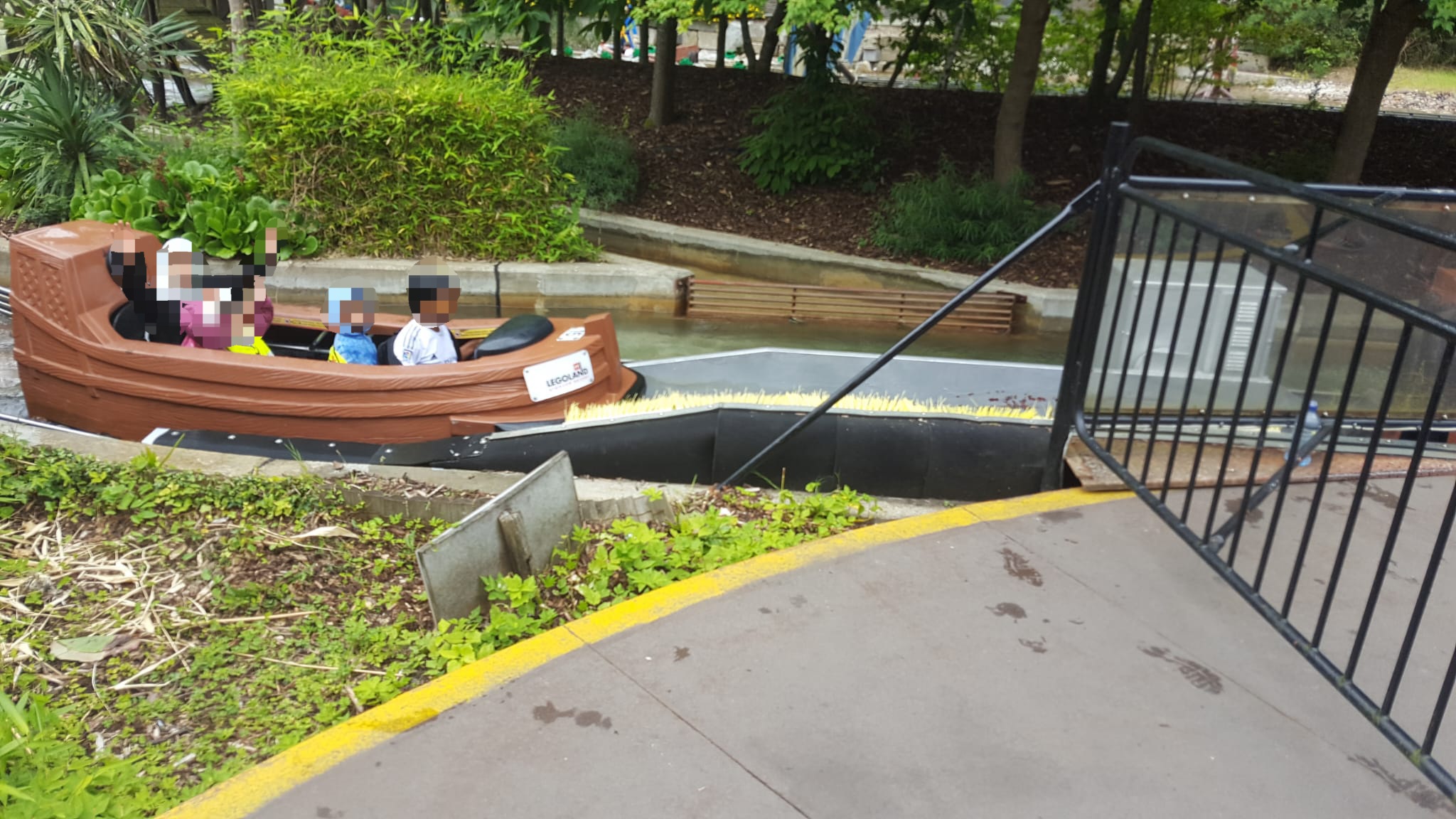 Children in boat ride on water attraction