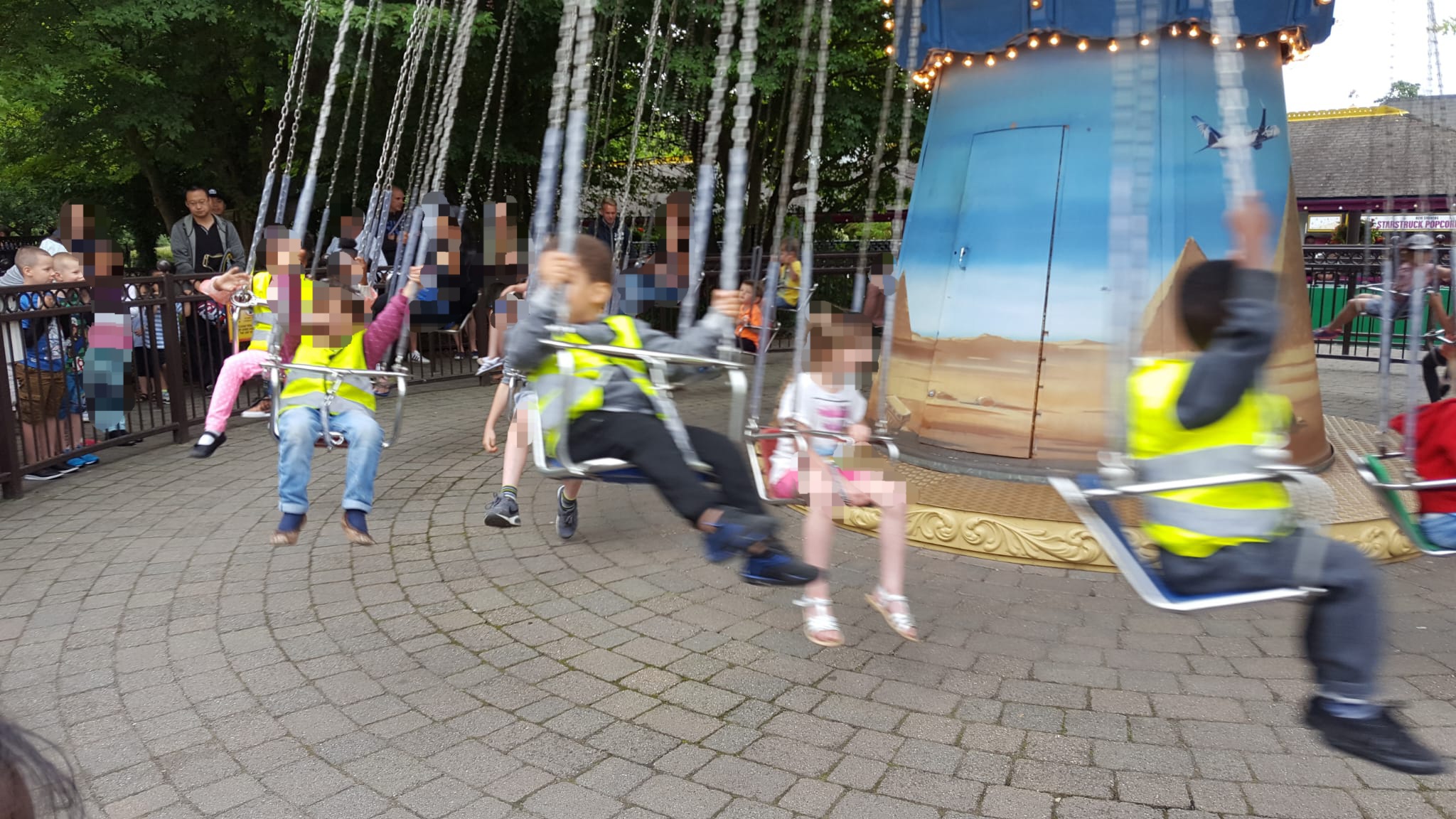 Children playing on swings at outdoor playground