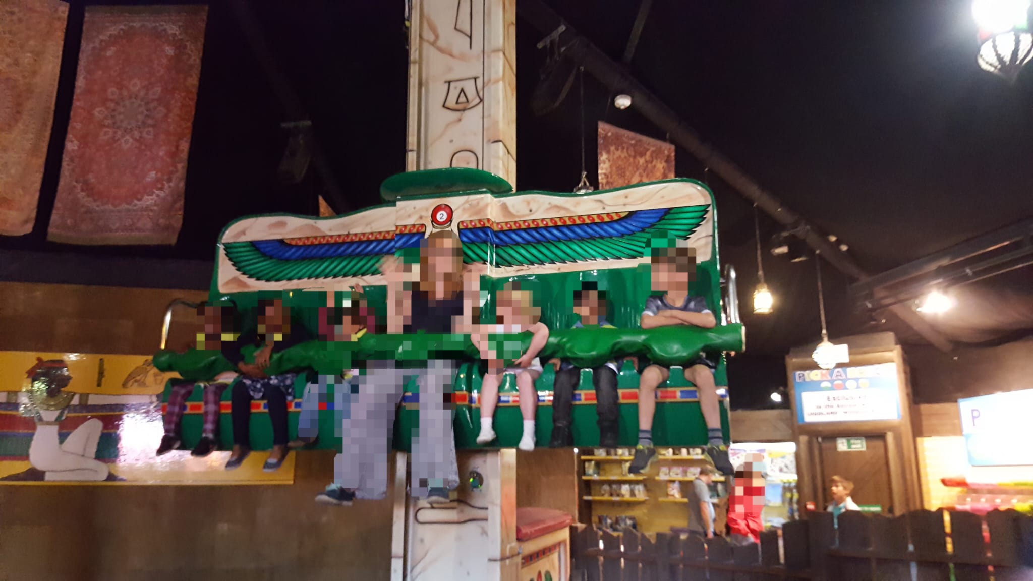 Children on themed pirate ship ride