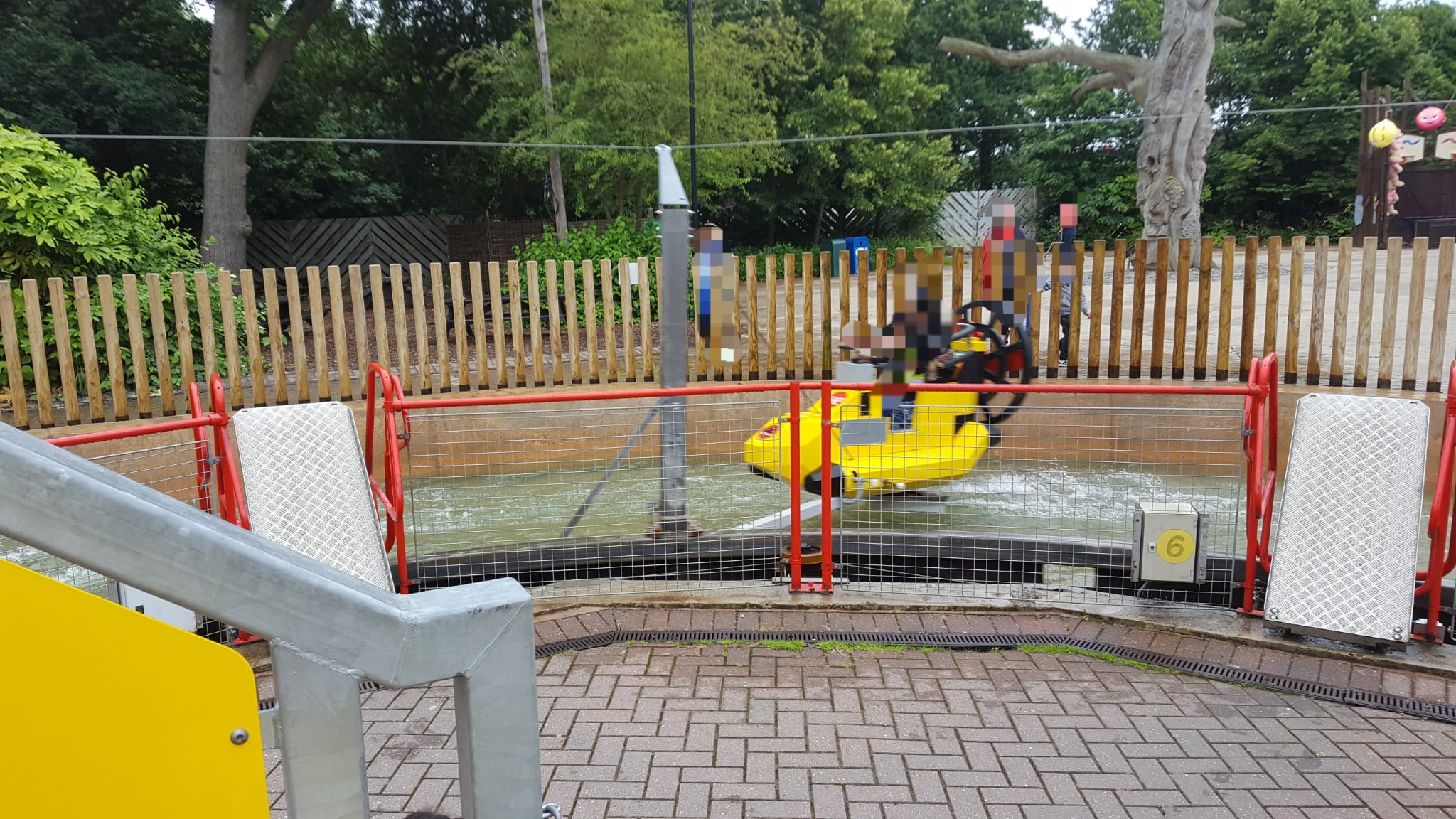 Children riding yellow water attraction