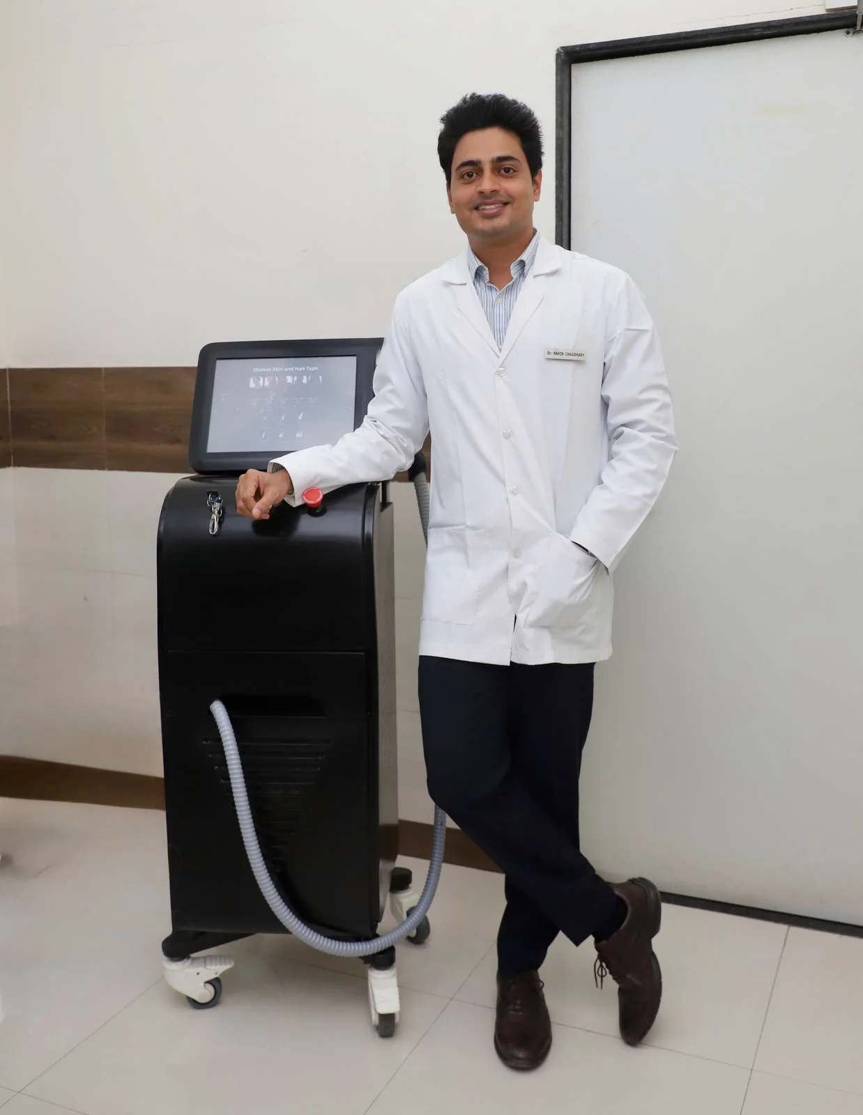 Dr. Navin with Triple Wavelength Laser Equipment