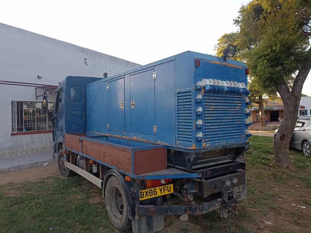 Professional blue transport truck with audio-visual equipment enclosure