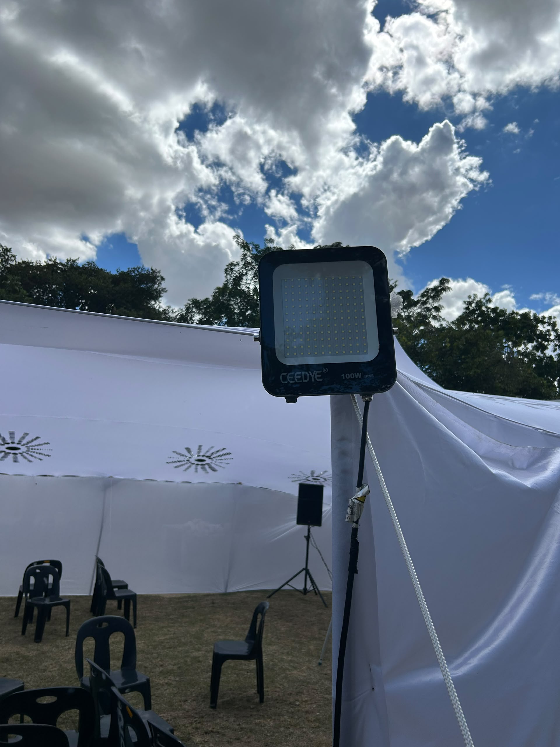 Professional outdoor tent lighting with CEEDYE LED floodlight mounted on tent frame