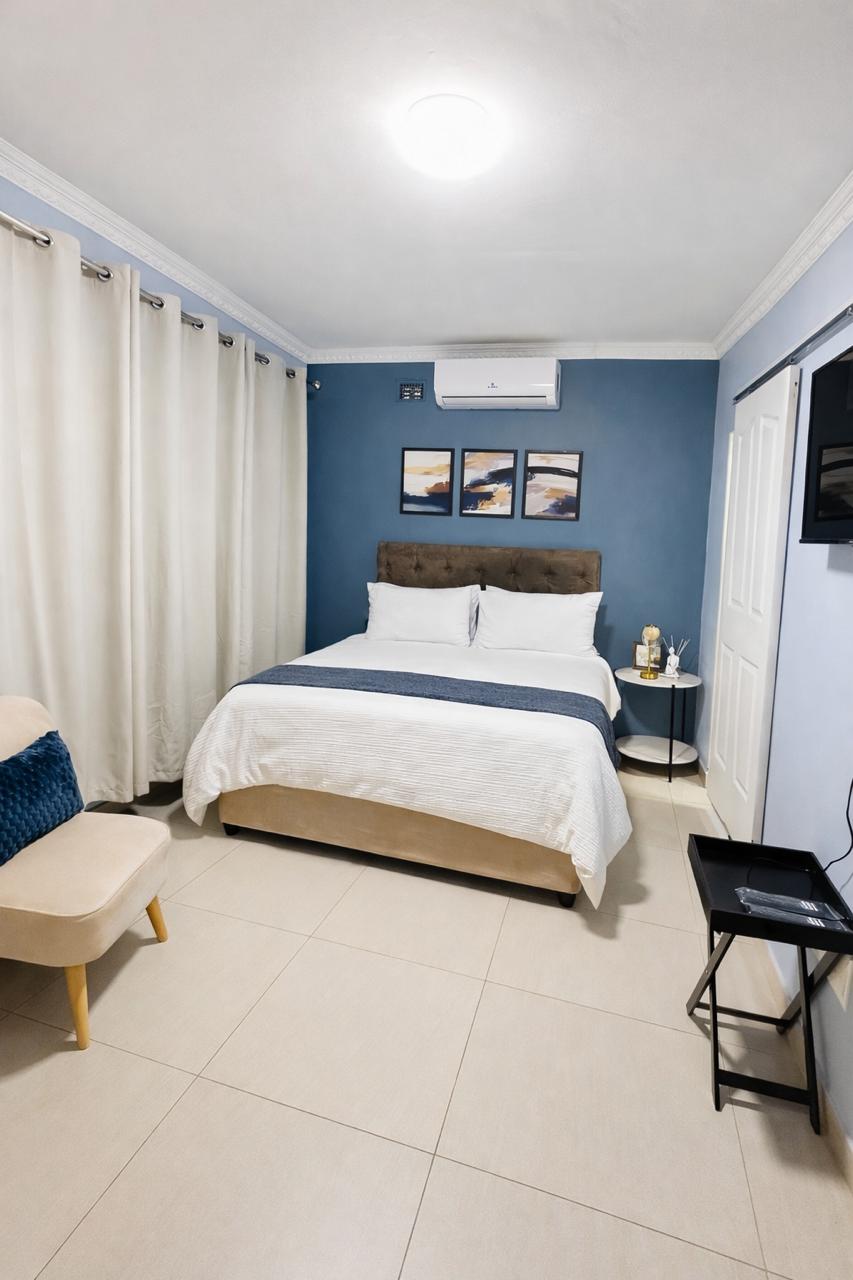Room 2 with queen bed and shared bathroom