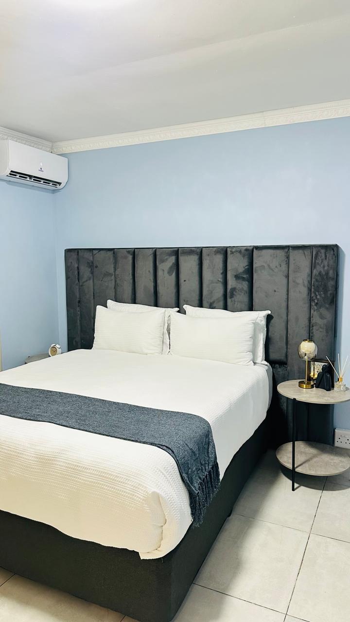 Room 1 with queen bed and shared bathroom