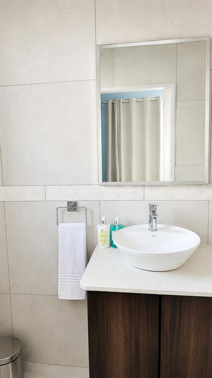 Elegant vanity with framed mirror and fresh towels