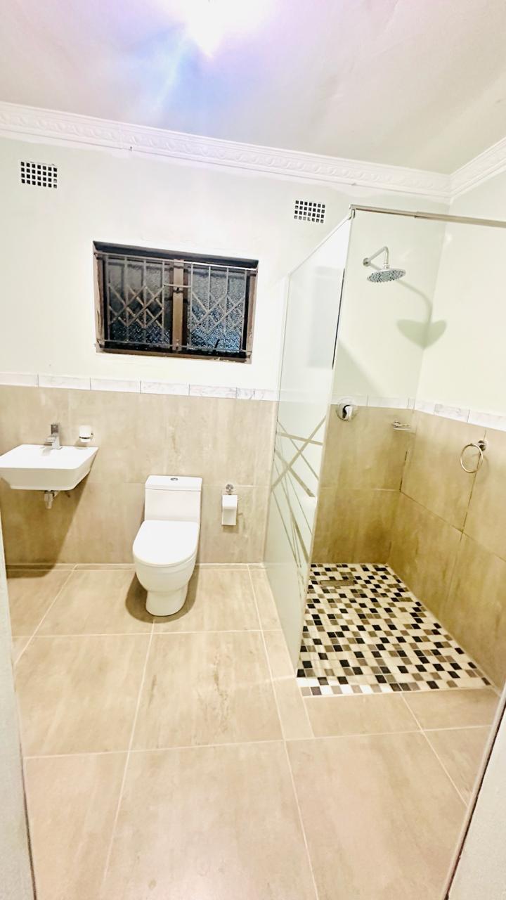 Modern walk-in shower and vanity