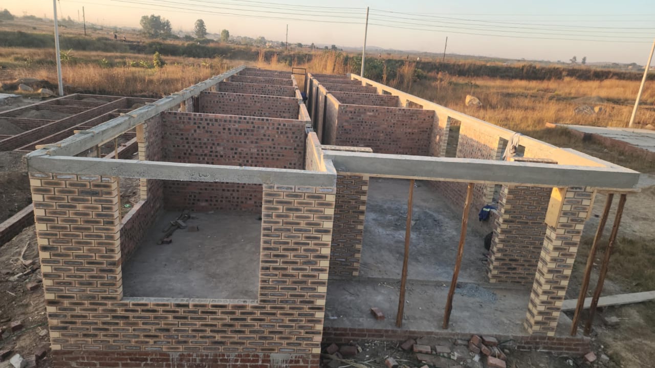 Structural building — brick walls at lintel height, aerial view of room layout