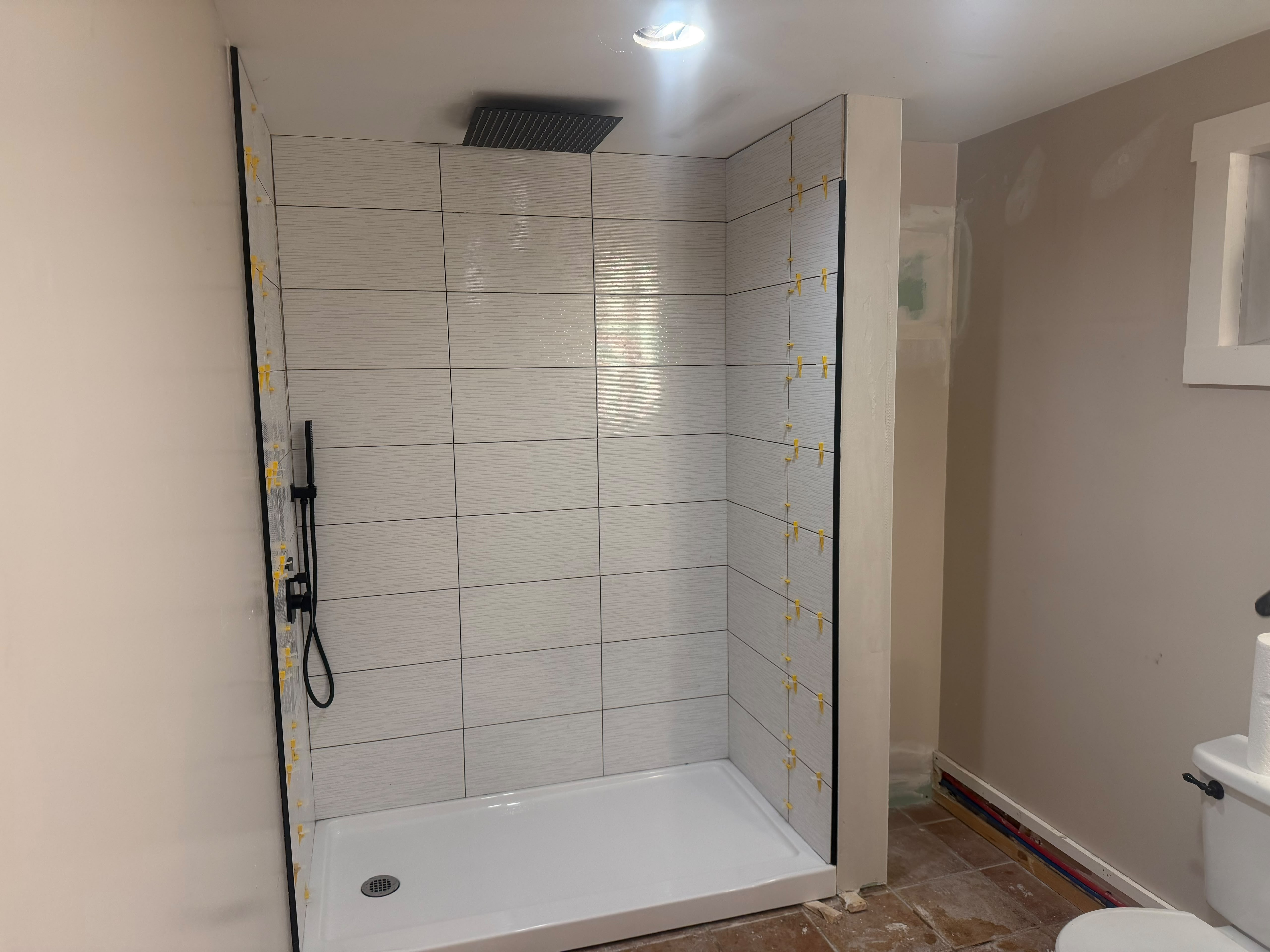 A clean, level bathroom transformation in progress