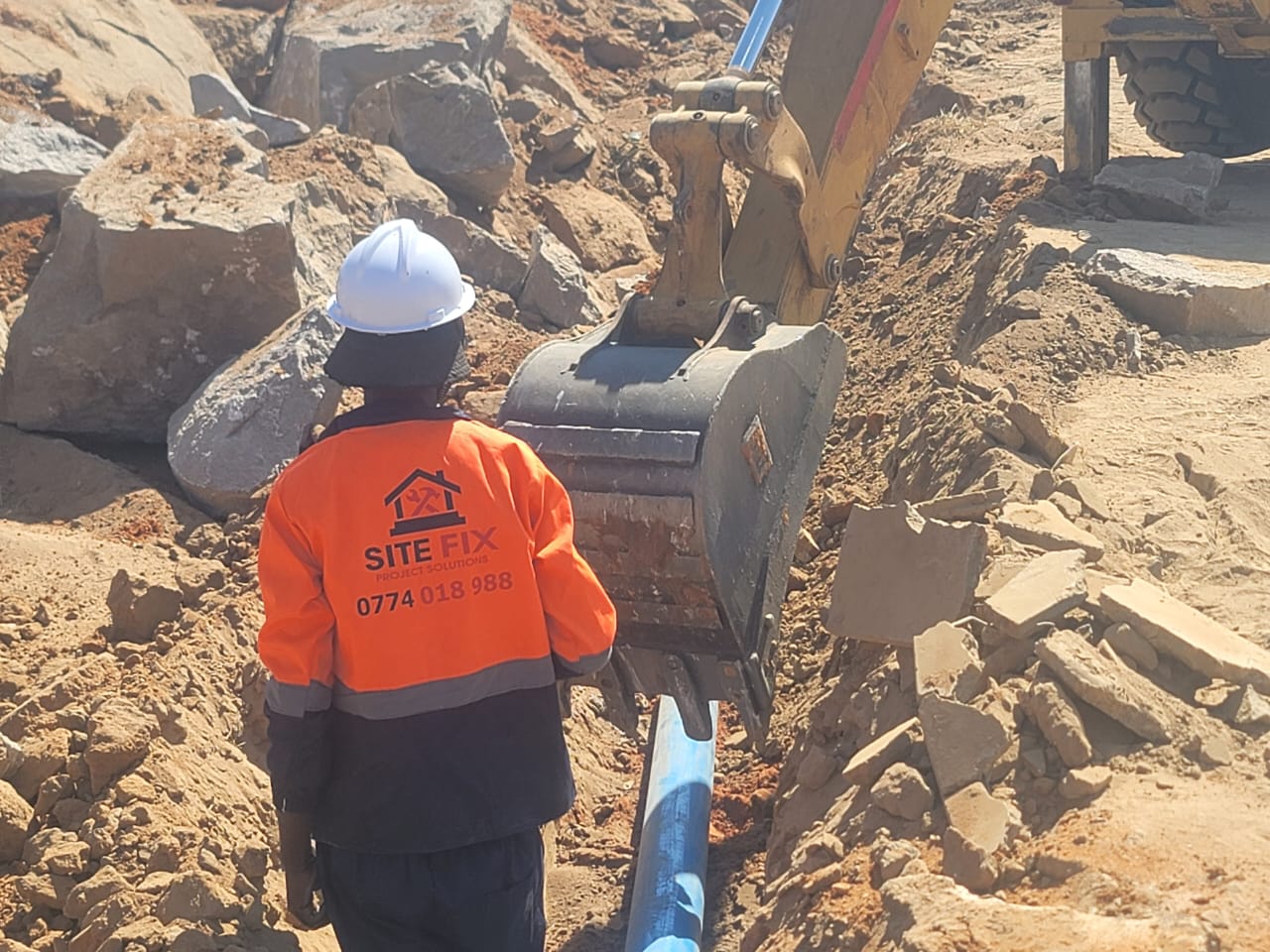 SiteFix worker overseeing excavation