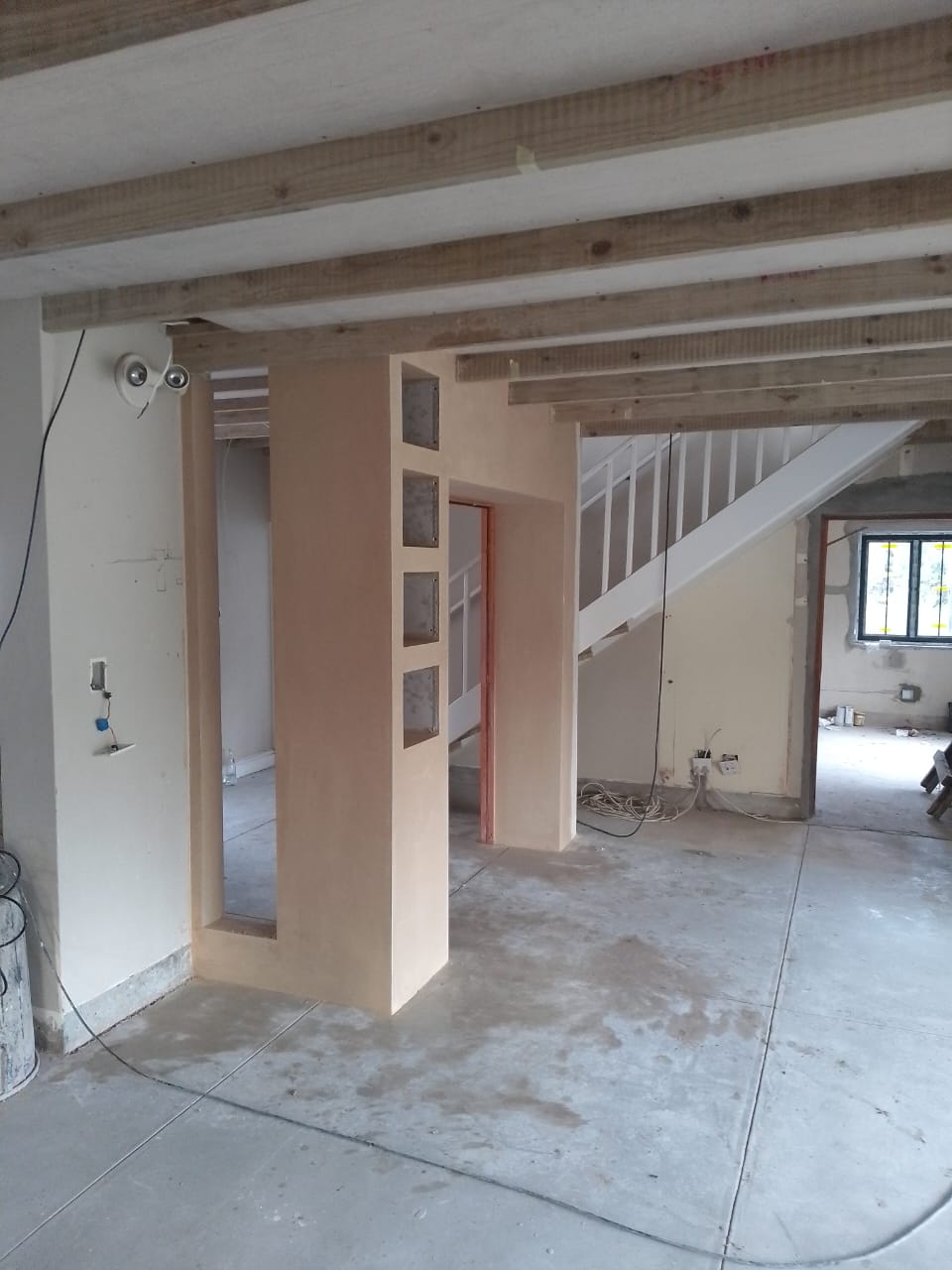 Plastered interior with timber detailing
