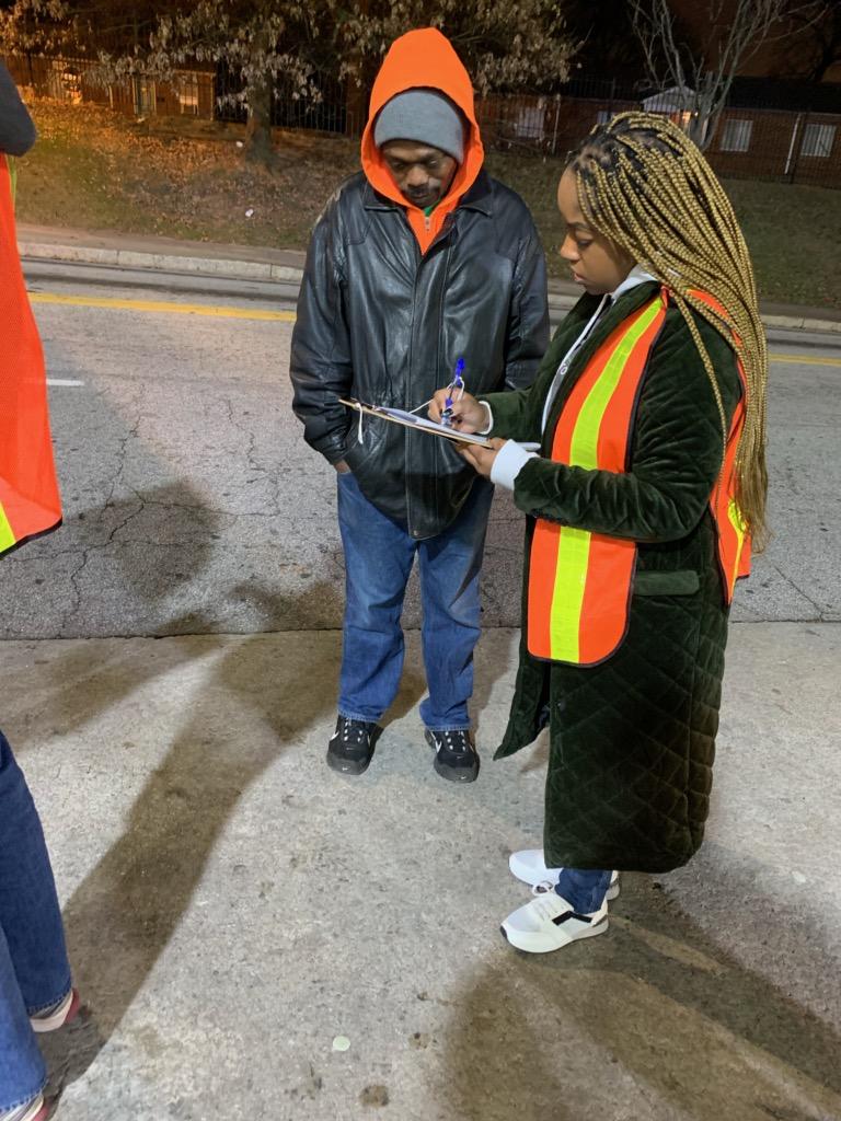 Evening outreach with volunteer helping community member