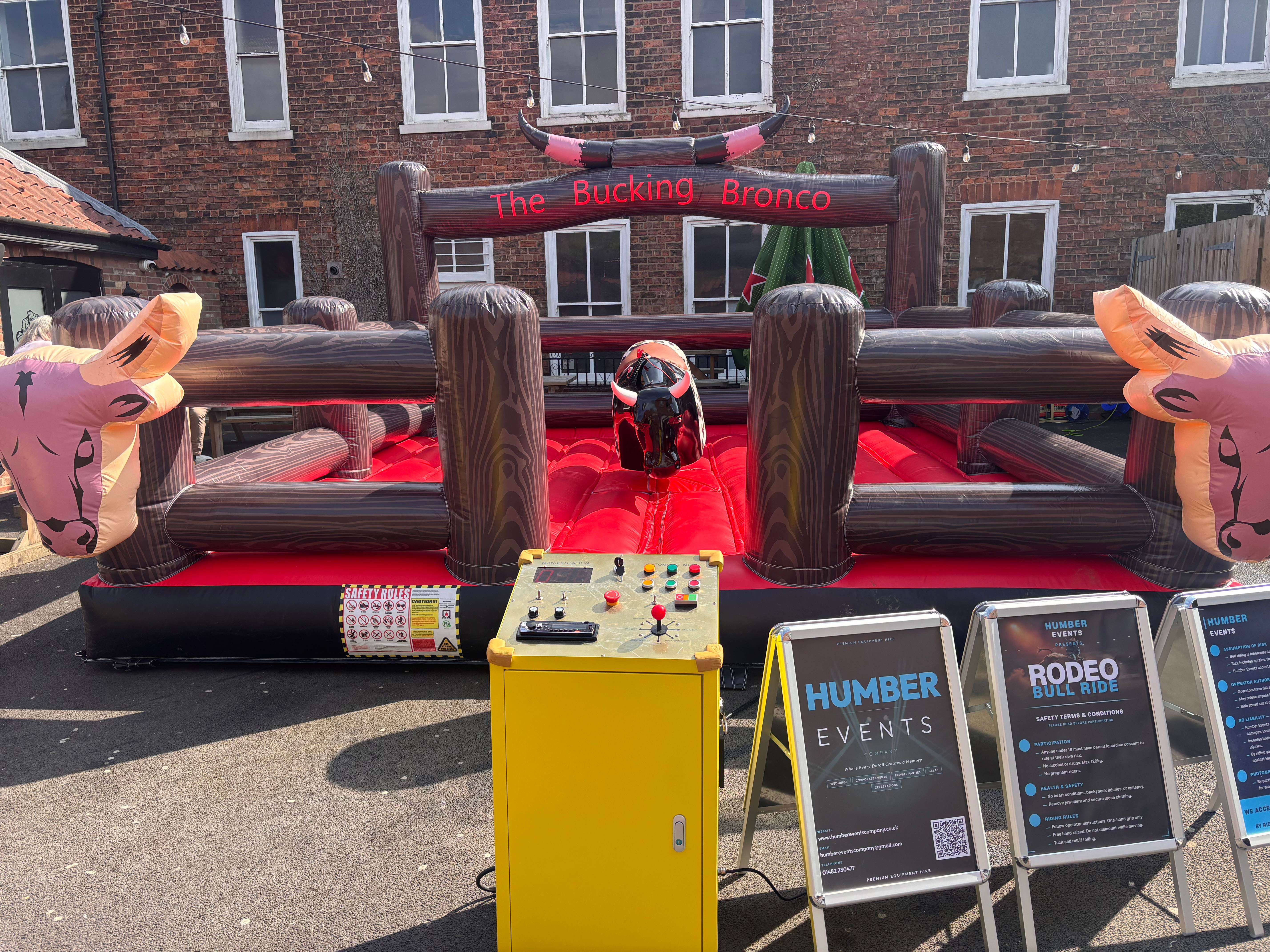 The Bucking Bronco mechanical rodeo bull with control panel