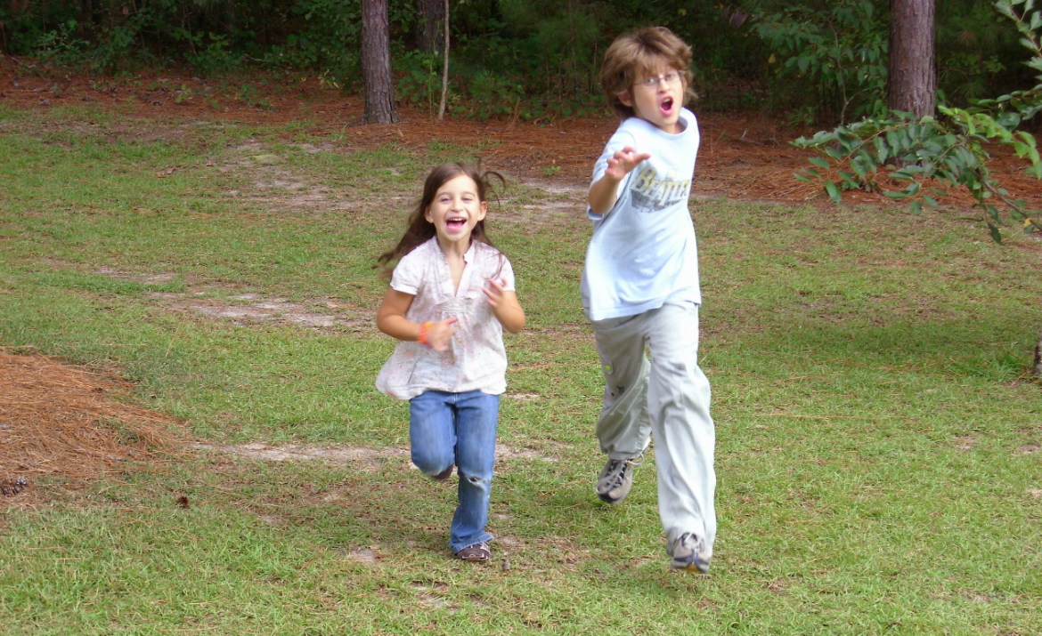 Alex playing with young girl outdoors
