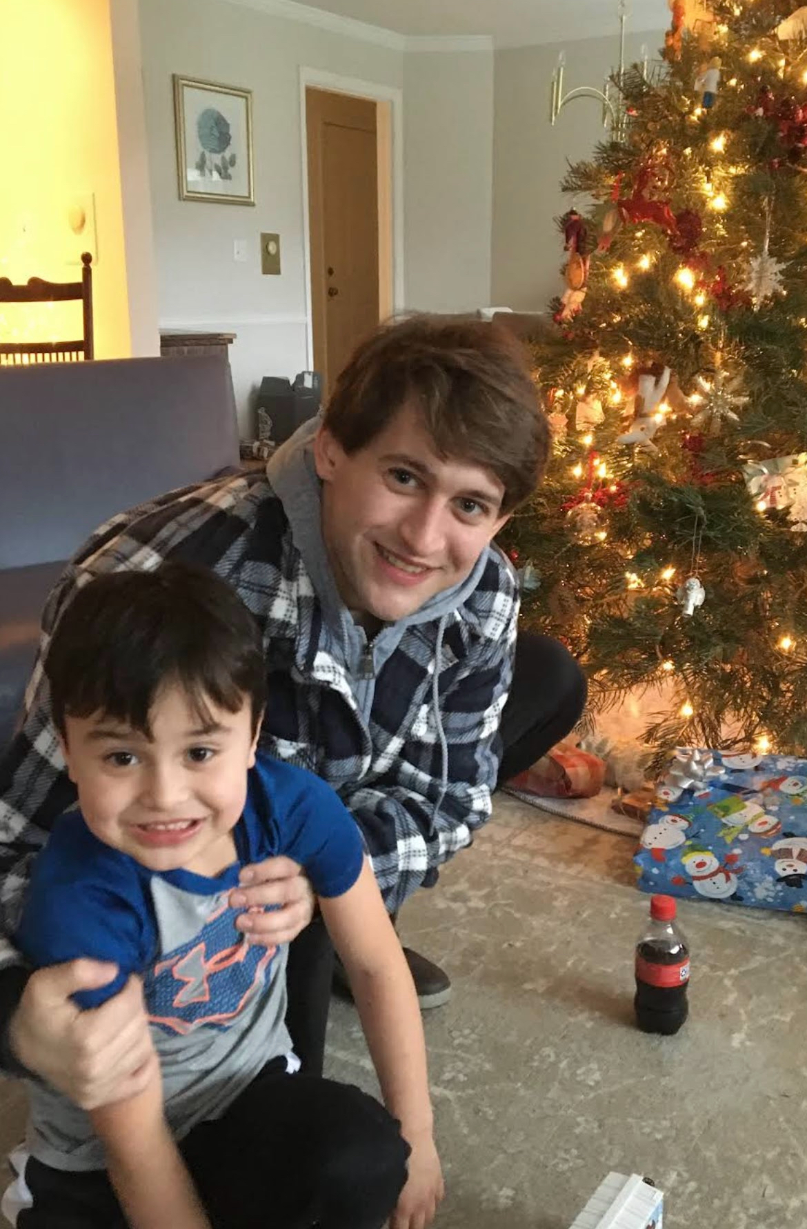 Alex with child at Christmas