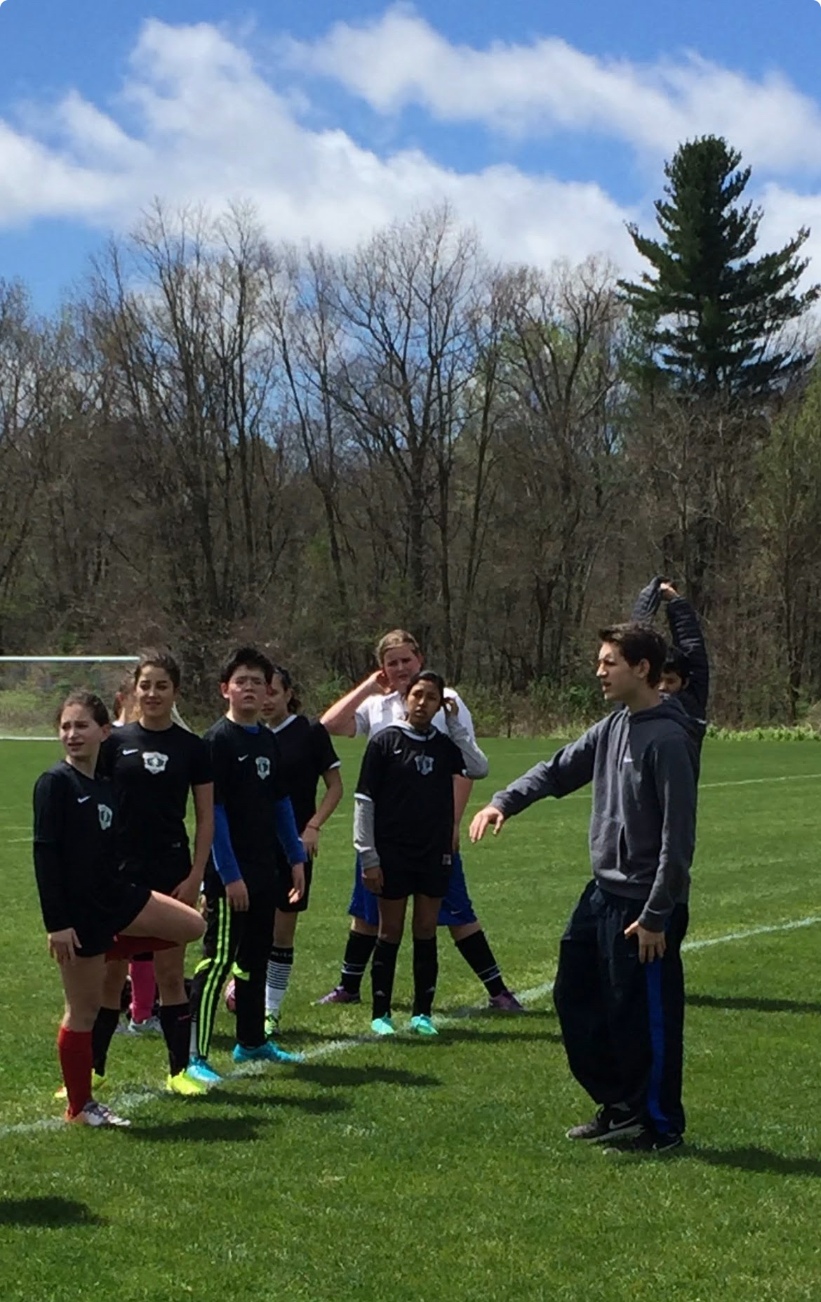 Alex coaching young soccer players