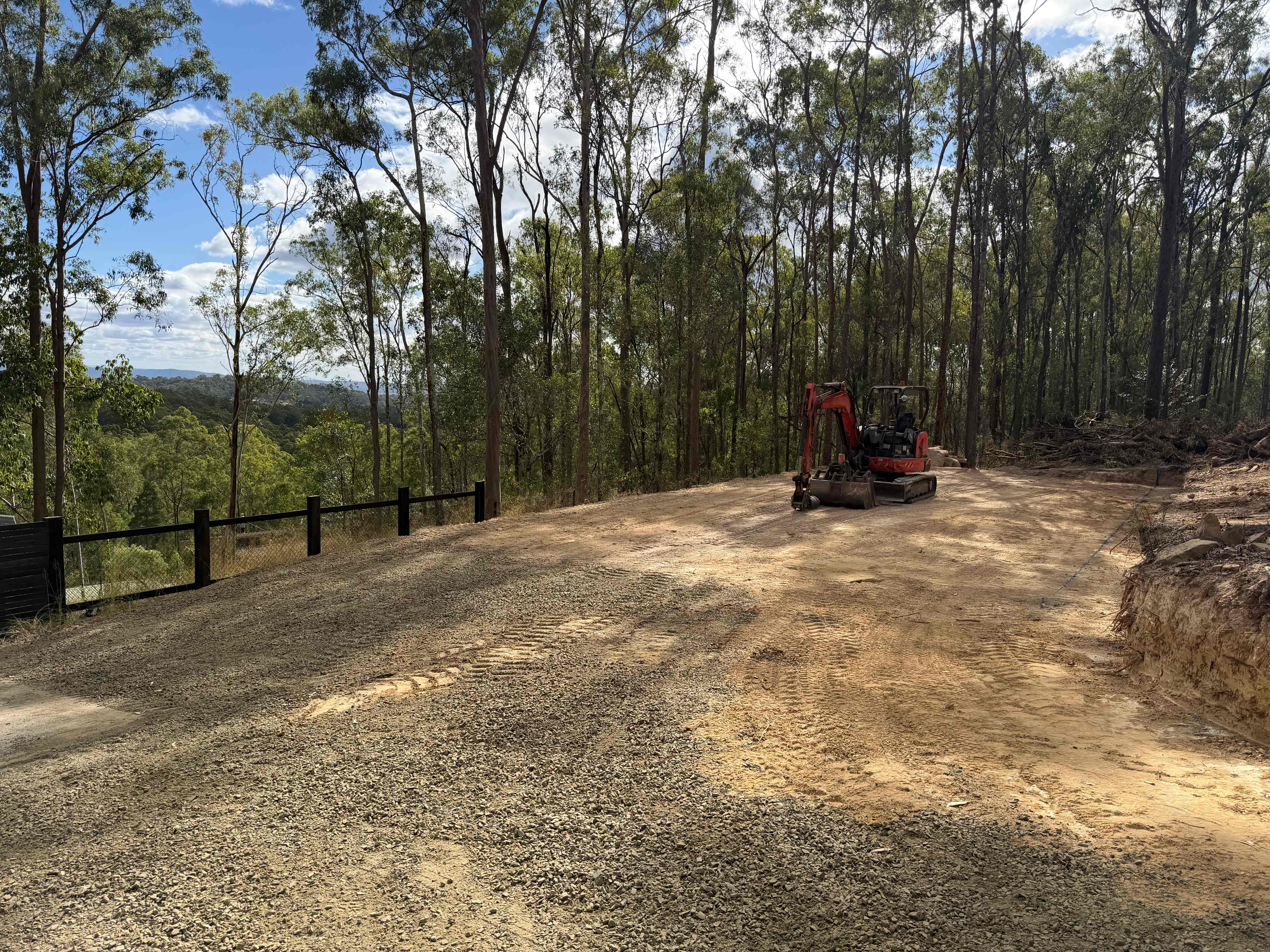 Site grading and clearing with excavator in Queensland bush setting
