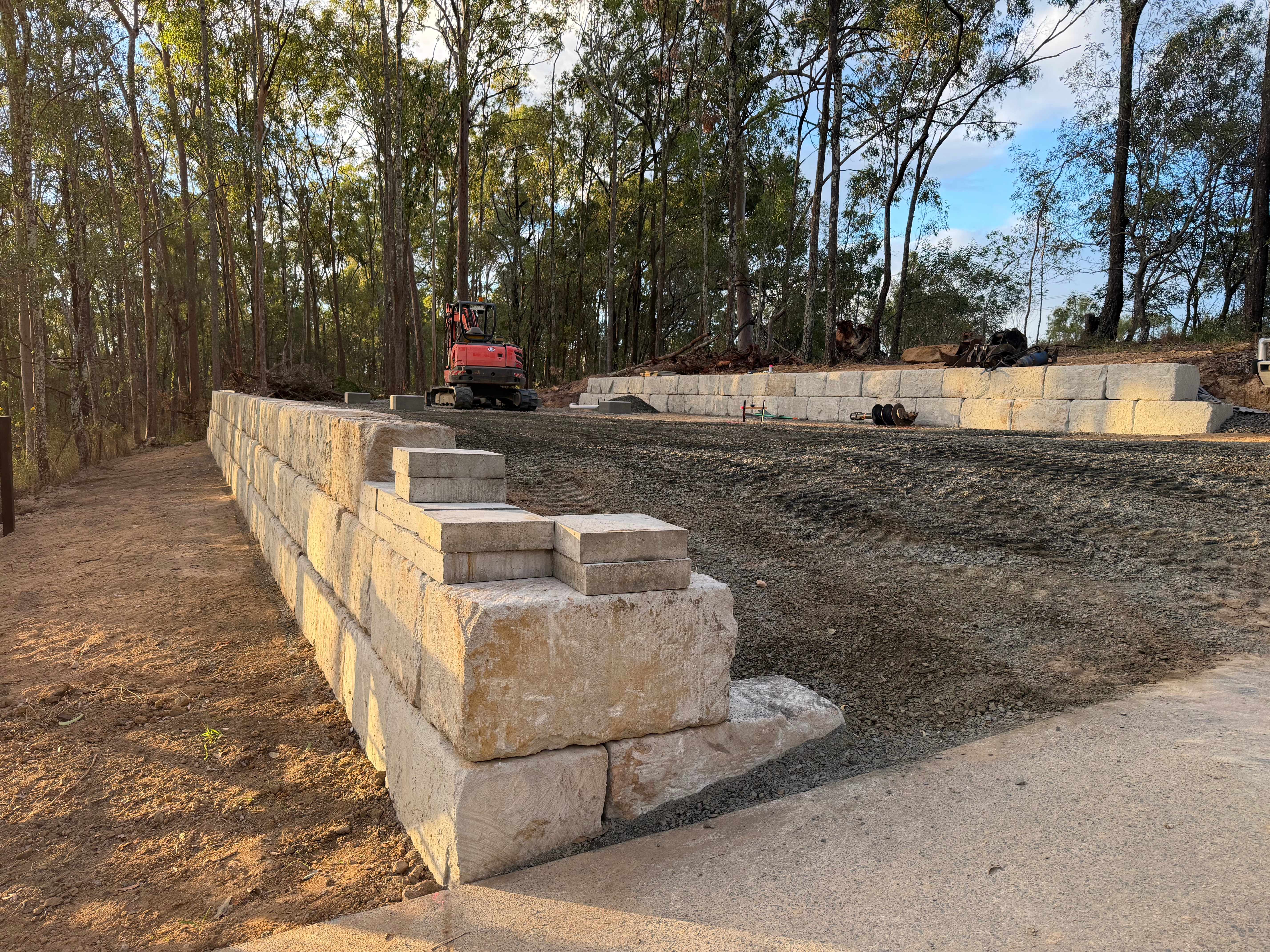 Sandstone block wall with steps in bushland setting