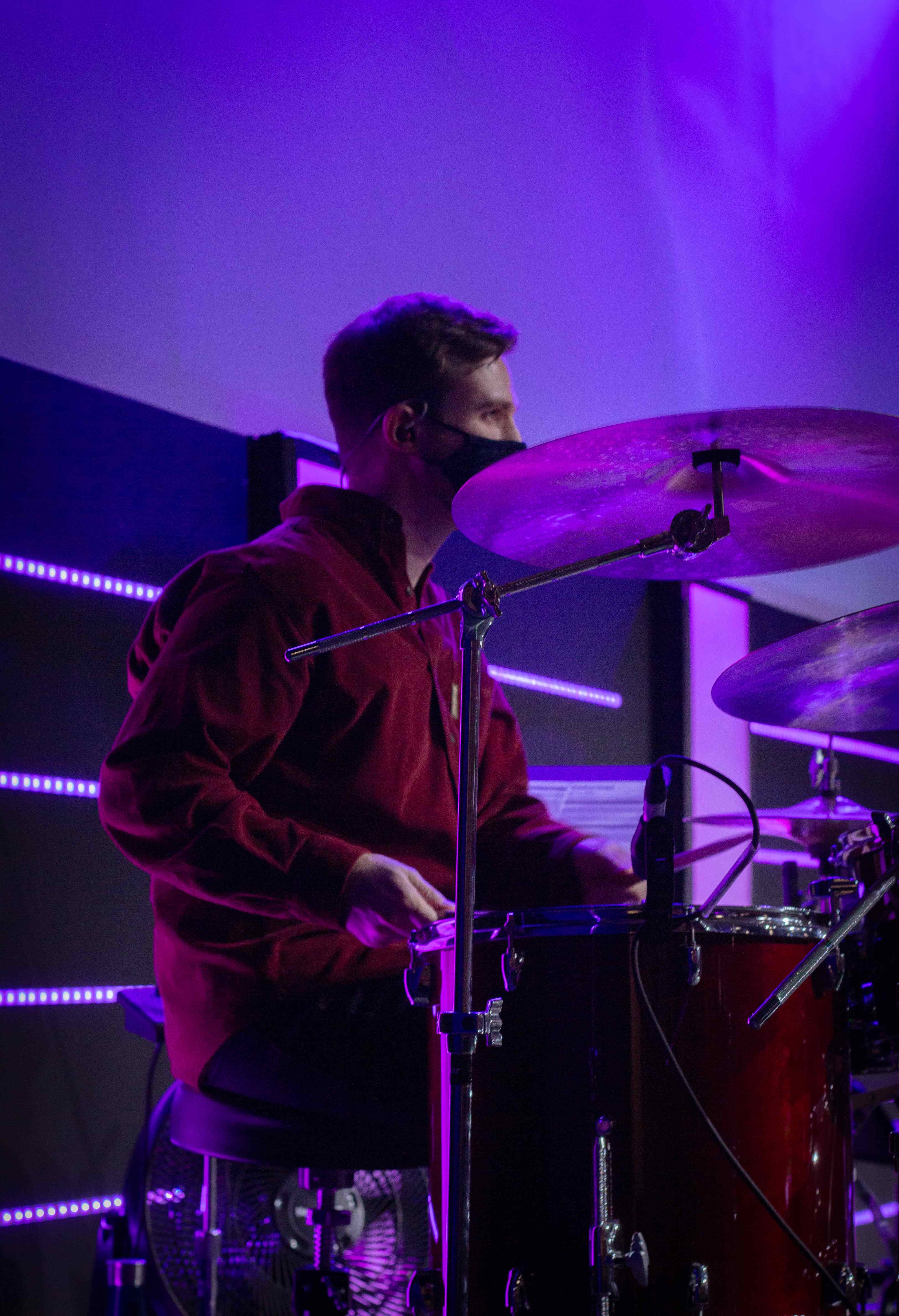 Drummer with purple lighting
