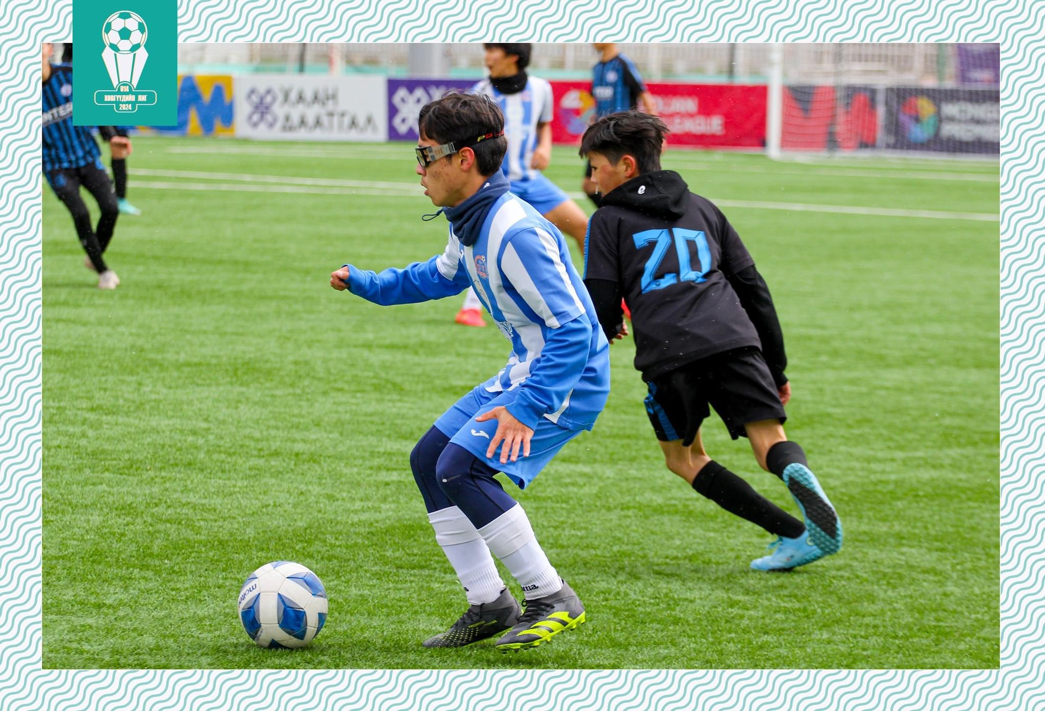 Erkhembold dribbling past defender