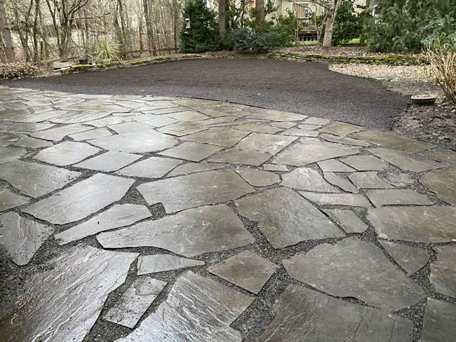 Irregular flagstone patio with crushed-rock transition