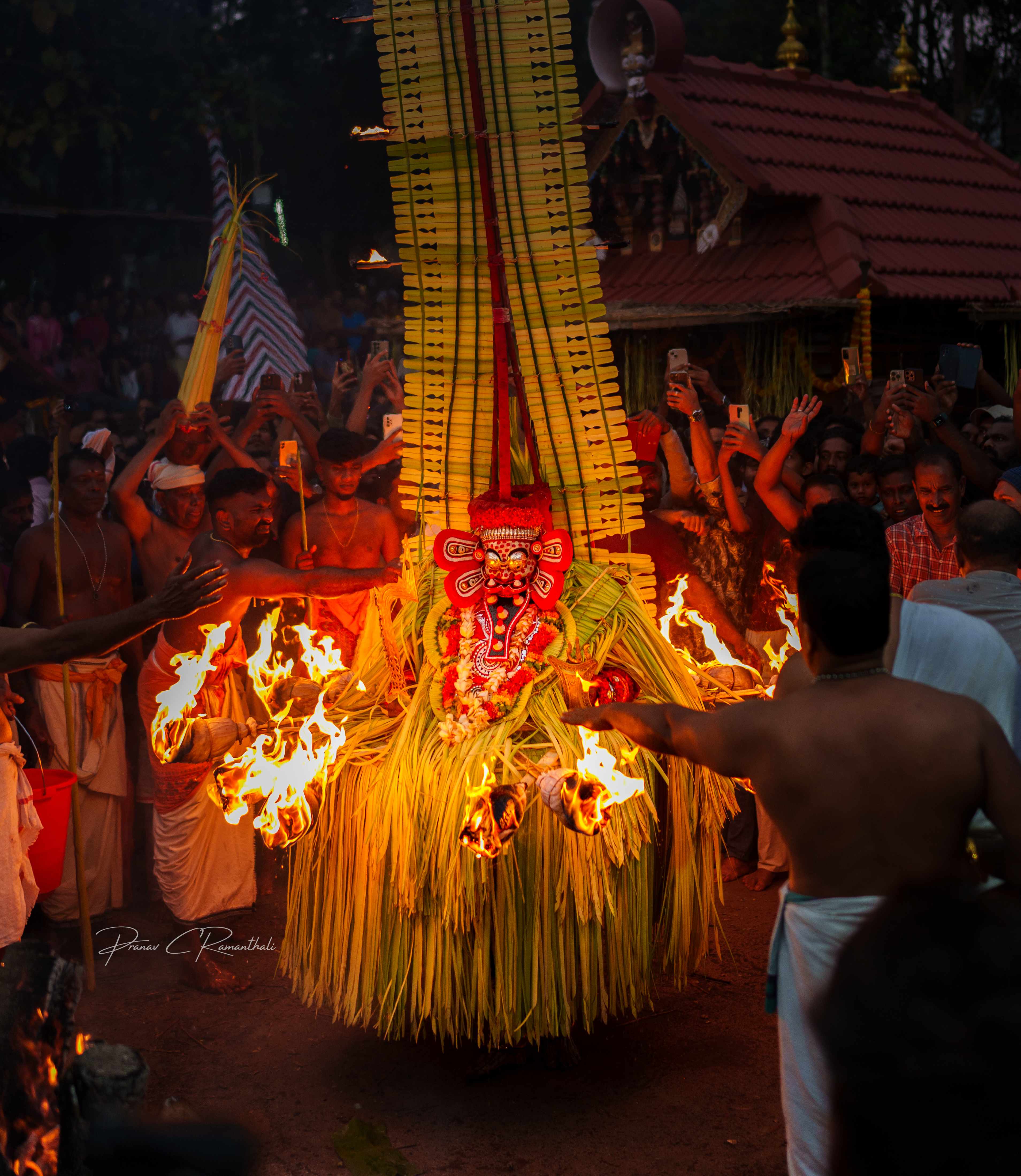 Close-up of Theyyam performer during fire ritual