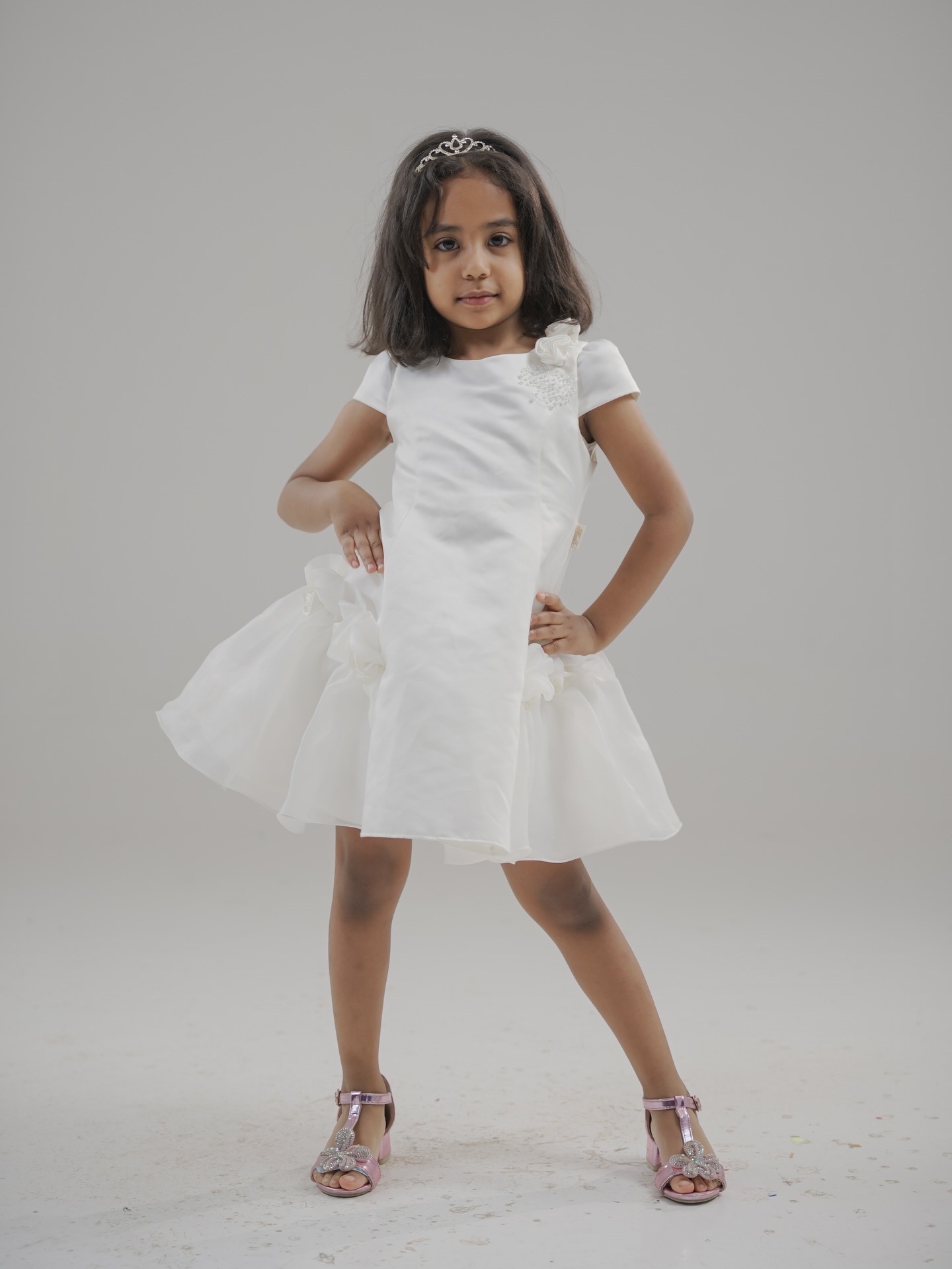 Child model in a white dress